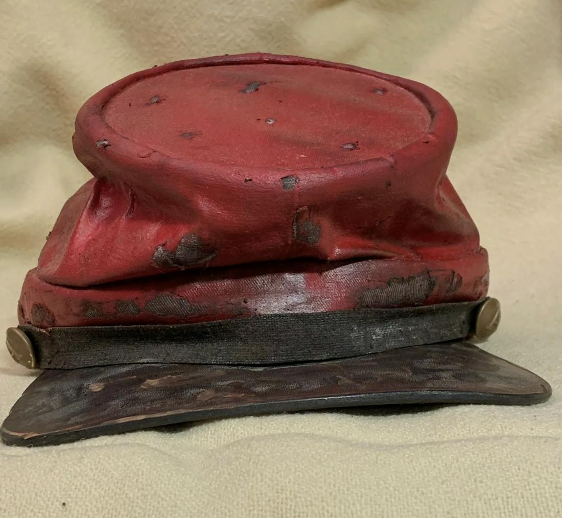 OLD CIVIL WAR CONFEDERATE ARTILLERY KEPI CAP: OLD CIVIL WAR CONFEDERATE ARTILLERY KEPI CAP. IN GOOD OVERALL SHAPE AND CONDITION WITH A NICE PATINA THROUGHOUT. APPEARS TO BE HEAVILY WORN. HAS THE A "ARTILLERY" BUTTONS ON THE SIDES. THIS IS A RED P