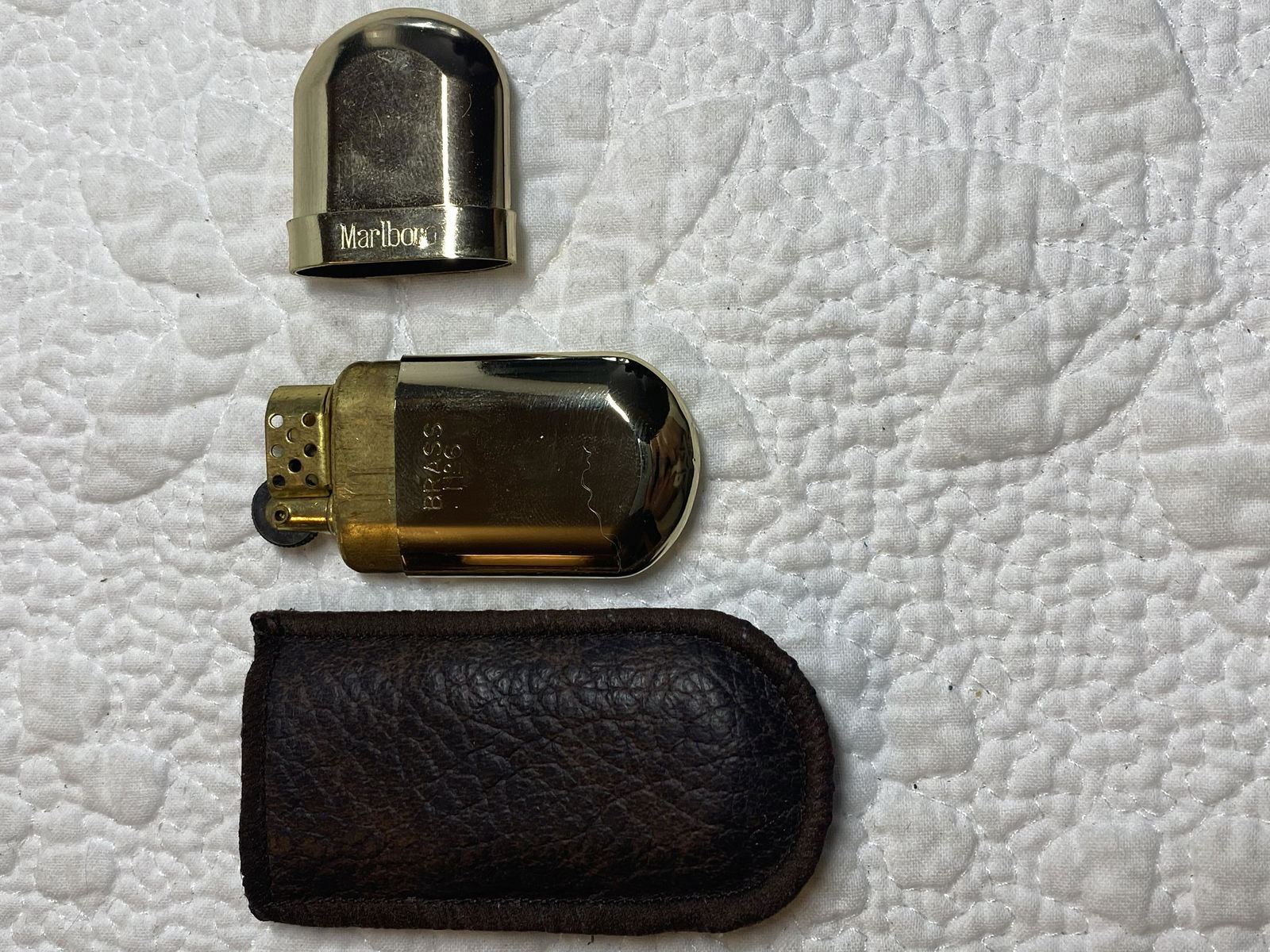 VINTAGE MARLBORO LIGHTER IN CASE: VINTAGE MARLBORO LIGHTER IN CASE. IN MINT OVERALL SHAPE AND CONDITION. A GREAT FIND.
