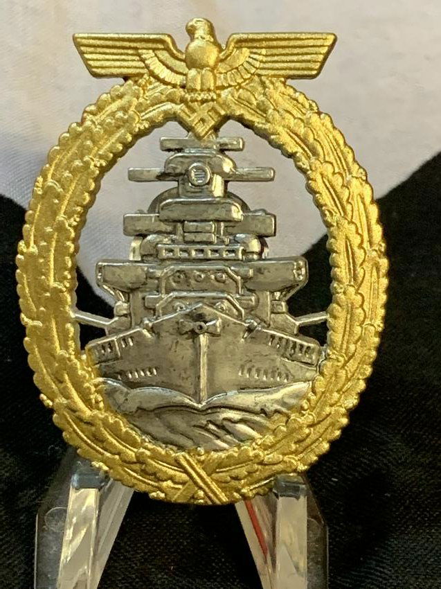 WW2 GERMAN NAZI HIGH SEAS FLEET WAR BADGE - GES GESCH: WW2 GERMAN NAZI HIGH SEAS FLEET WAR BADGE - MAKER MARKED GES GESCH ON THE HINGE. THE BADGE IS AN EARLIER STYLE . THIS BADGE RETAINS MUCH OF ITS GILD FINISH AND SHOWS SOME OF THE ORIGINAL LACQUER TO TH