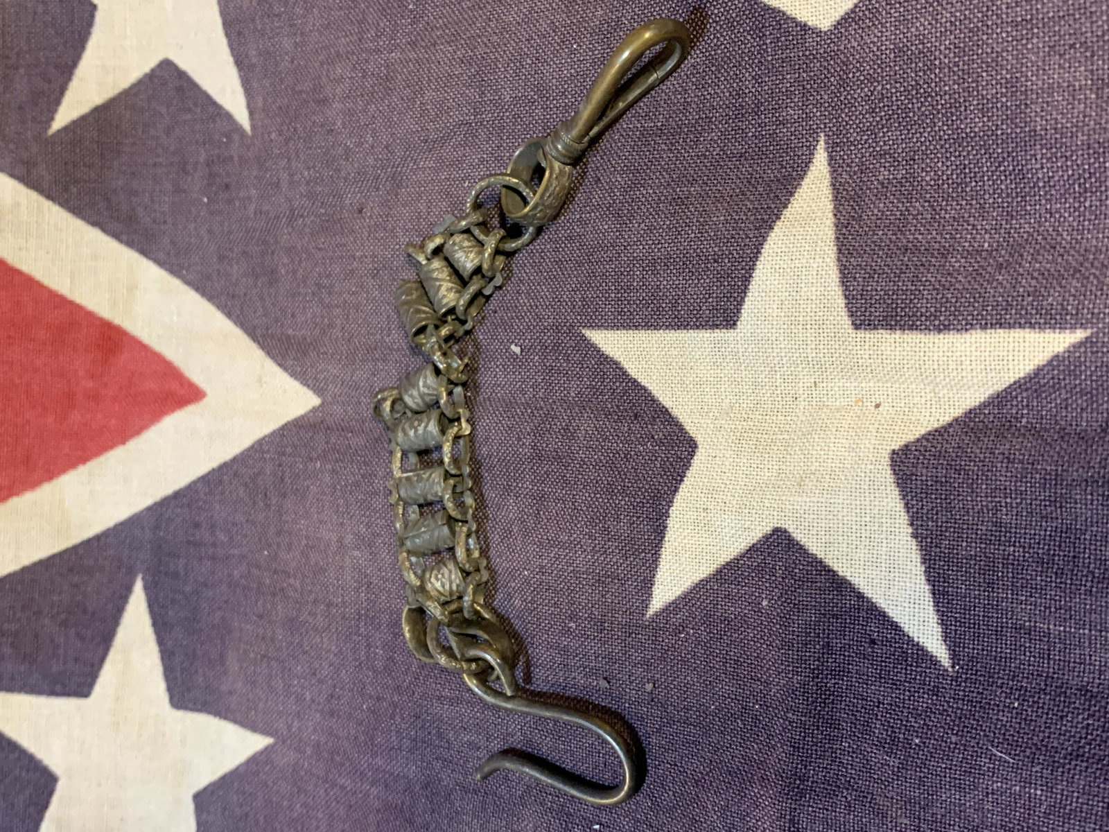 CIVIL WAR CONFEDERATE SWORD BELT HANGER: CIVIL WAR CONFEDERATE SWORD BELT HANGER. IN GOOD OVERALL SHAPE AND CONDITION WITH ONE BROKEN SIDE - VIEW PICTURES. A GREAT ADDITION TO YOUR COLLECTION.