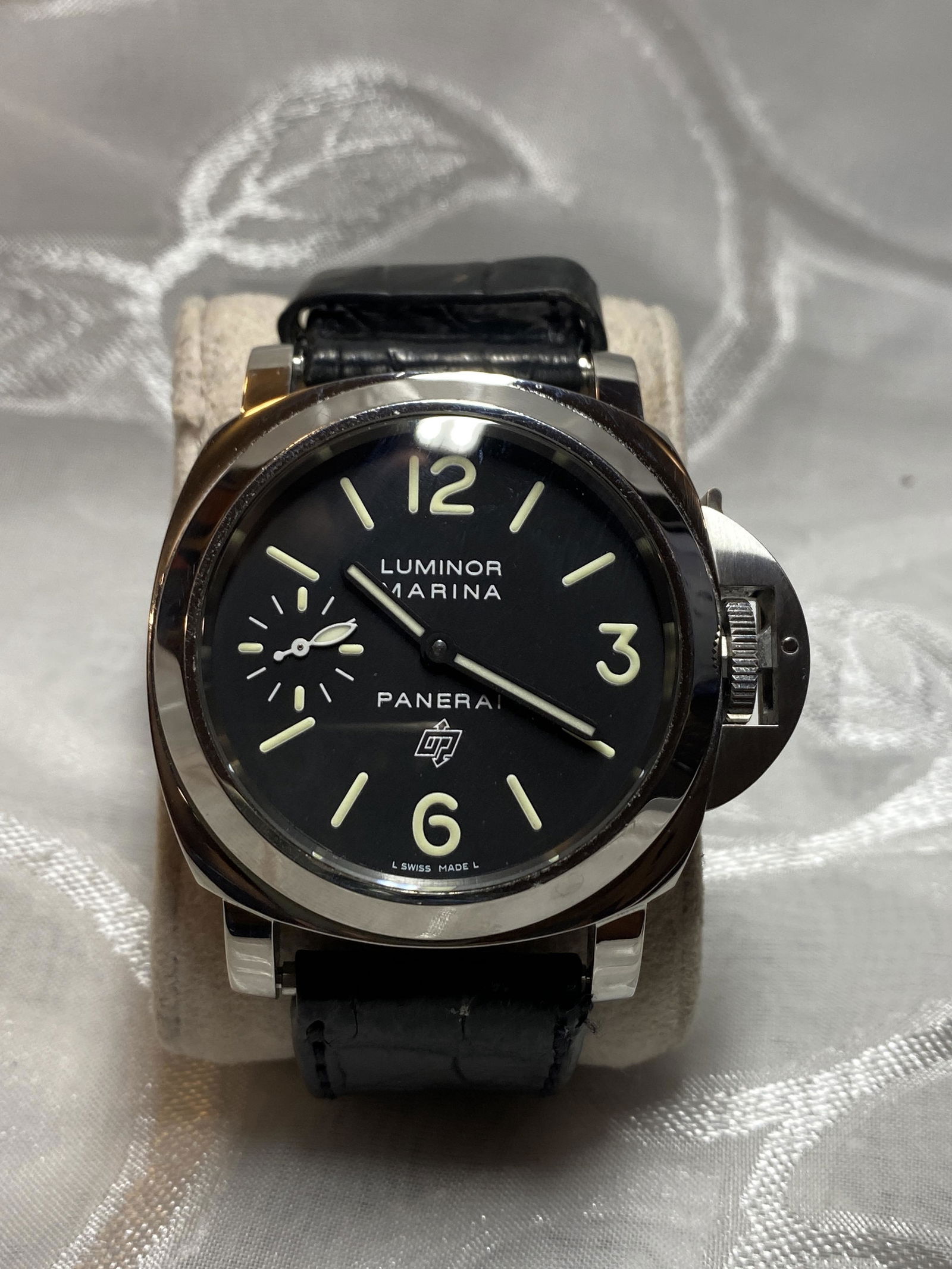 PANERAI LUMINOR MARINA MENS WATCH - UNAUTHENTICATED: PANERAI LUMINOR MARINA MENS WATCH - UNAUTHENTICATED. WATCH RUNS AND KEEPS PERFECT TIME. LOOKS LIKE NEW WITH MINIMAL USE. HAS A BEAUTIFUL LEATHER BAND ON IT. WATCH HAS THE PROTECTIVE SLEEVE ON THE TOP