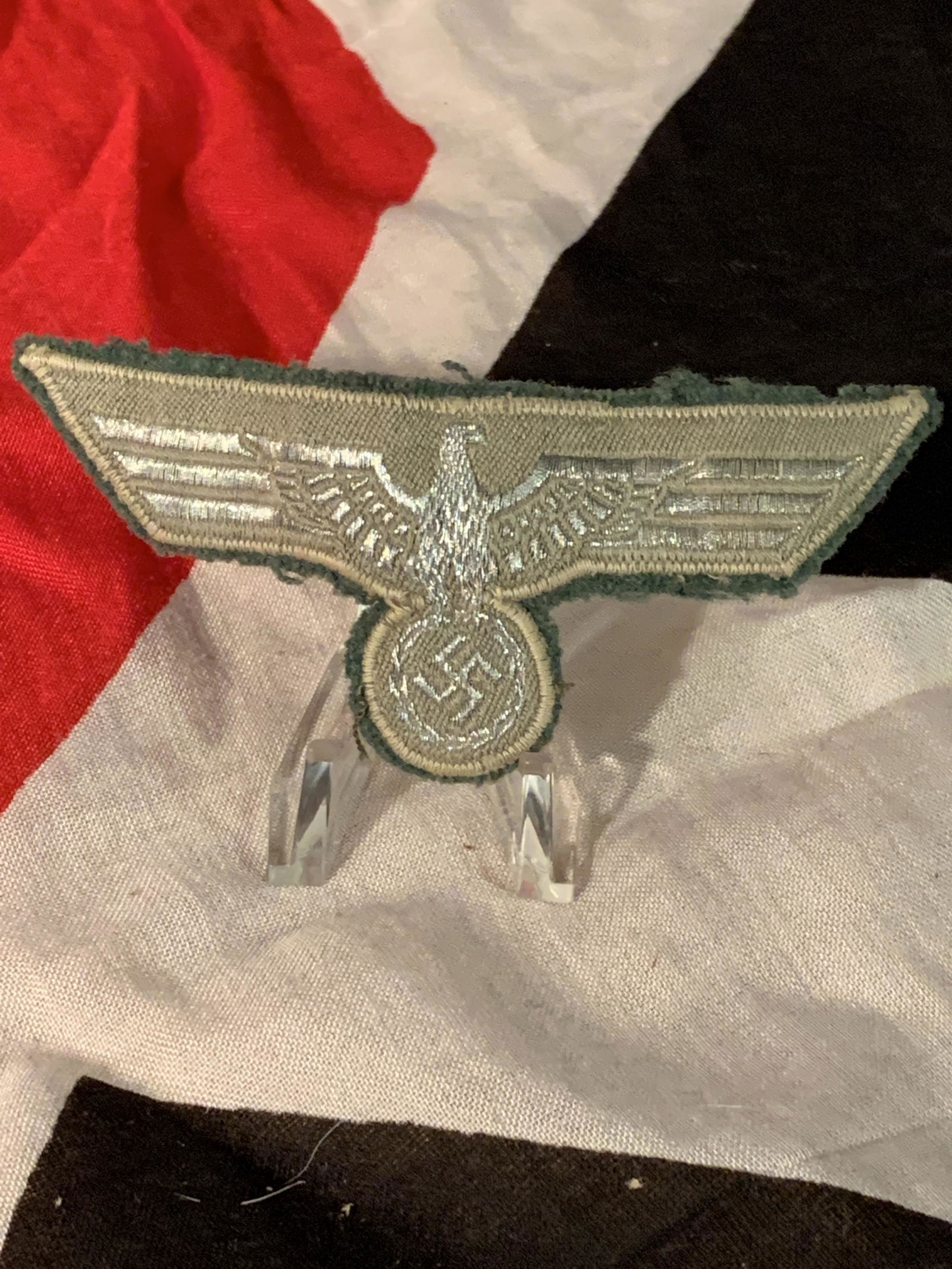 WW2 GERMAN ARMY BREAST EAGLE FOR PARADE DRESS UNIFORM: WW2 GERMAN ARMY BREAST EAGLE FOR PARADE DRESS UNIFORM. EXCELLENT EARLY EXAMPLE OF A SILVER FLAT WIRE EAGLE ON A GREY CLOTH BACKING. THIS WOULD BE FOR ANY RANK ON AN EARLY PARADE DRESS ARMY UNIFORM. A
