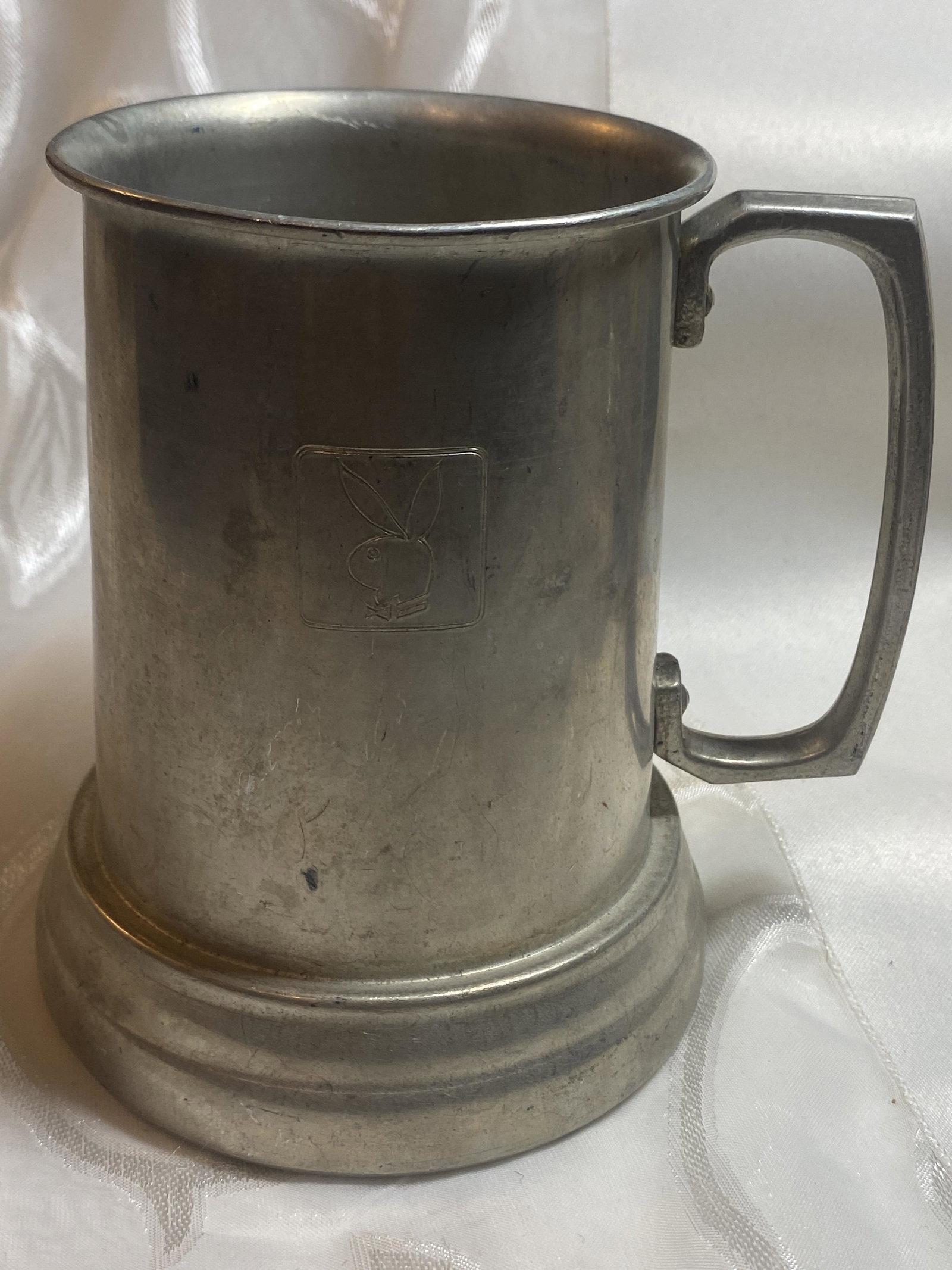 VINTAGE SILVER PLAYBOY BUNNY MUG: VINTAGE SILVER PLAYBOY BUNNY MUG. IN GOOD OVERALL SHAPE AND CONDITION. A GREAT FIND AND AN EXCELLENT ADDITION TO YOUR COLLECTION.