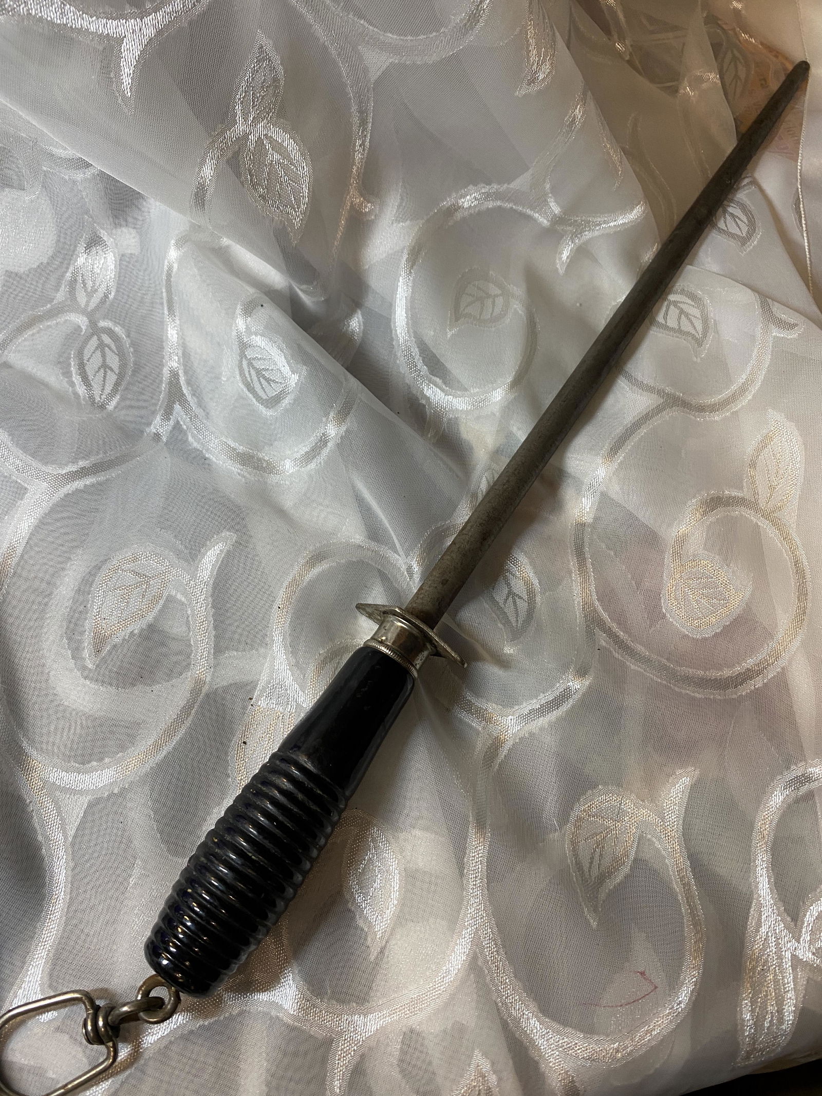 ANTIQUE LARGE RUSSELL KNIFE SHARPENER: ANTIQUE LARGE RUSSELL KNIFE SHARPENER. BEAUTIFUL EBONY HANDLE. PLEASE VIEW ALL DETAILED PICTURES. THIS HISTORIC ITEM COMES FROM AND WAS DISPLAYED AT THE NINEPIPES MUSEUM MONTANA. MR. KNAPP HELPED ACQU