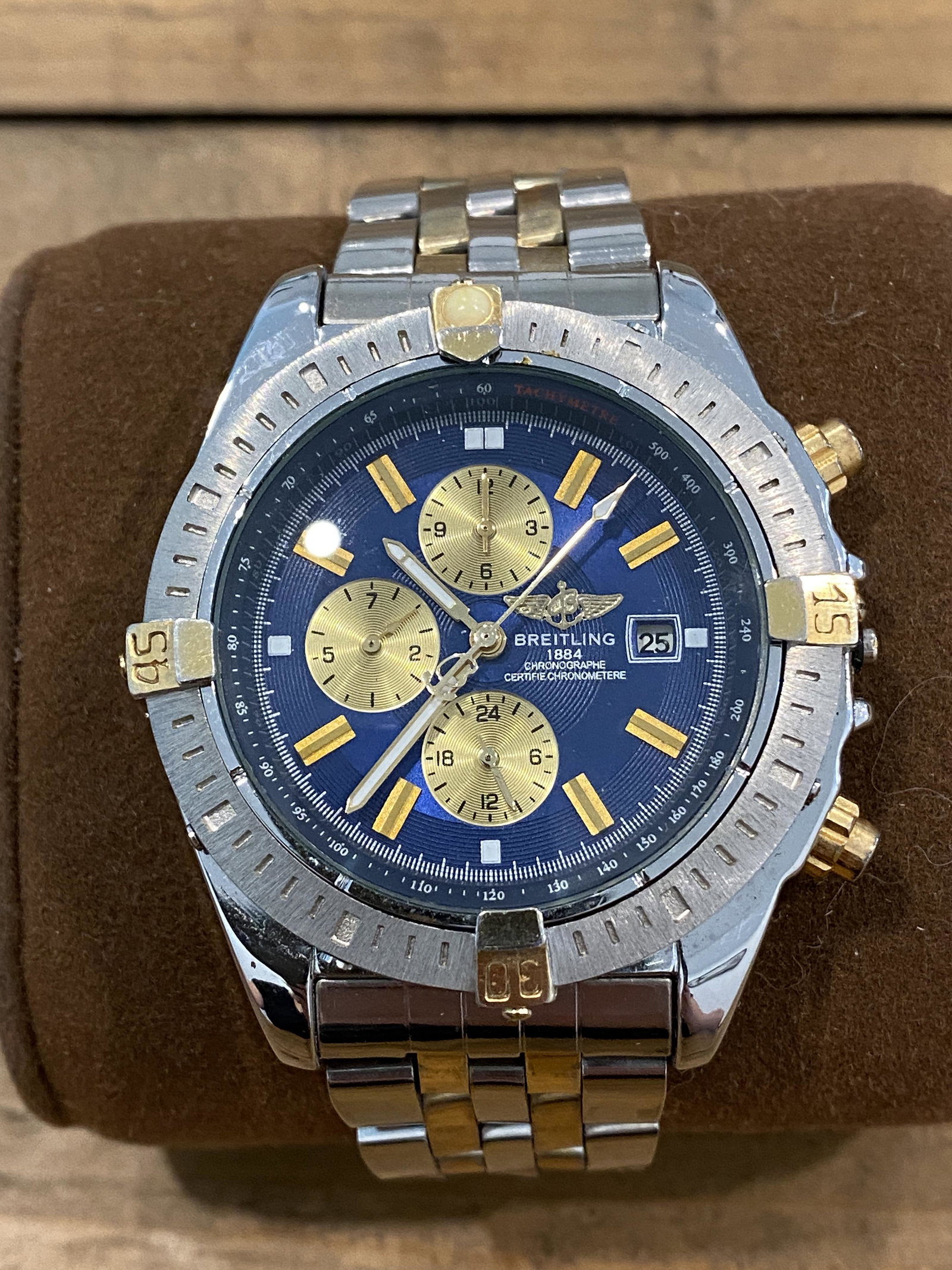 ESTATE BREITLING MENS 2 TONE WATCH: ESTATE BREITLING MENS 2 TONE WATCH. WATCH APPEARS TO BE MISSING THE WINDING STEM ON THE SIDE. THIS WATCH IS BEING SOLD AS-IS, AS FOUND AT AN ESTATE SETTLEMENT. WE ARE NOT SURE IF THE WATCH WORKS OR NO