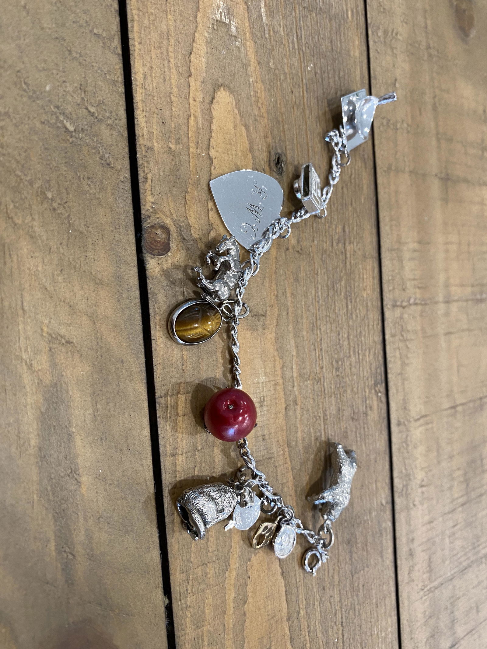 HIGH GRADE STERLING SILVER CHARM BRACELET: HIGH GRADE STERLING SILVER CHARM BRACELET. BEAUTIFUL BRACELET FOR EVERYDAY WEAR.