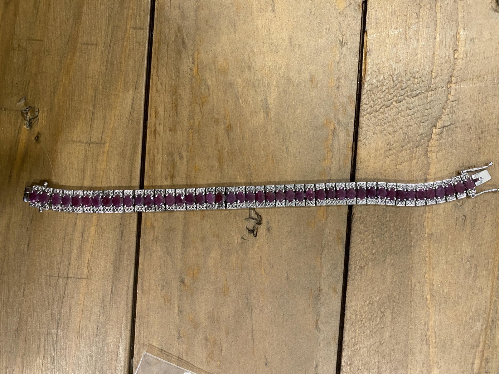 ANTIQUE STERLING SILVER NATURAL RUBY TENNIS BRACELET: ANTIQUE STERLING SILVER NATURAL RUBY TENNIS BRACELET. IN GOOD OVERALL SHAPE AND CONDITION. PLEASE VIEW ALL DETAILED PICTURES. A GREAT FIND AND AN EXCELLENT ADDITION TO YOUR COLLECTION.