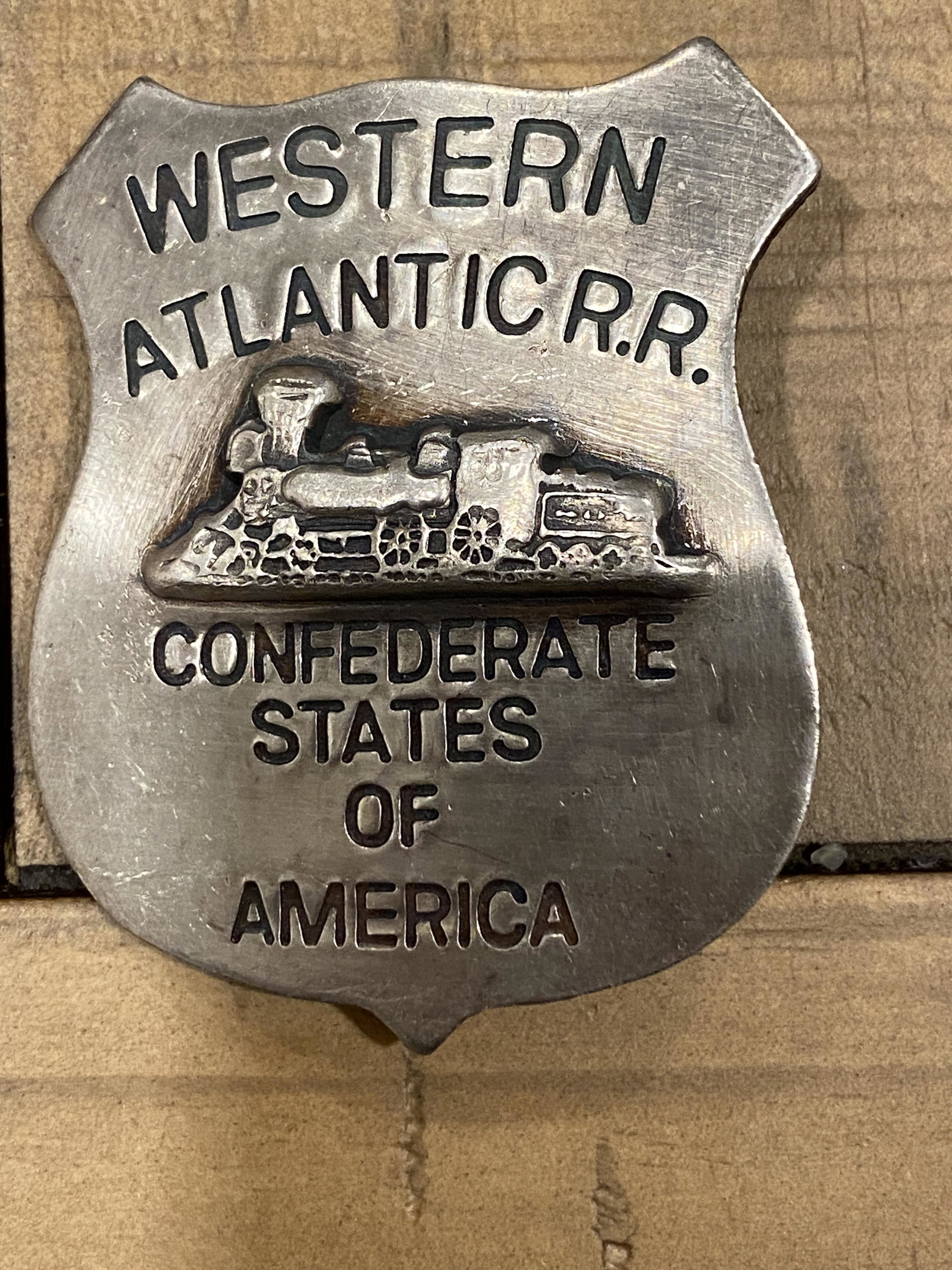 CIVIL WAR CONFEDERATE WESTERN ATLANTIC R.R. BADGE: CIVIL WAR CONFEDERATE WESTERN ATLANTIC R.R. BADGE. IN GOOD OVERALL SHAPE AND CONDITION WITH A BEAUTIFUL OVERALL PATINA. PLEASE VIEW ALL DETAILED PICTURES. A GREAT FIND AND AN EXCELLENT ADDITION TO YOU