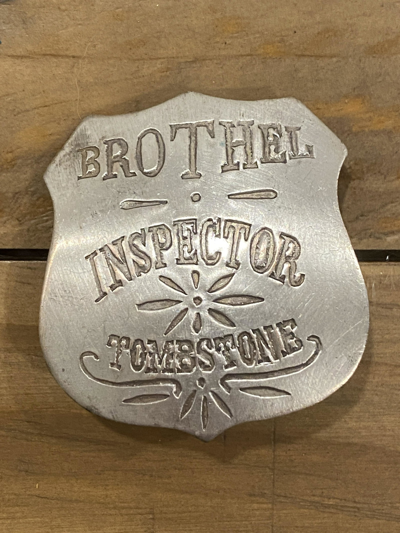 ANTIQUE BROTHEL INSPCTOR TOMBSTONE BADGE: ANTIQUE BROTHEL INSPCTOR TOMBSTONE BADGE. IN GOOD OVERALL SHAPE AND CONDITION. PLEASE VIEW ALL DETAILED PICTURES. A GREAT FIND AND AN EXCELLENT ADDITION TO YOUR COLLECTION.