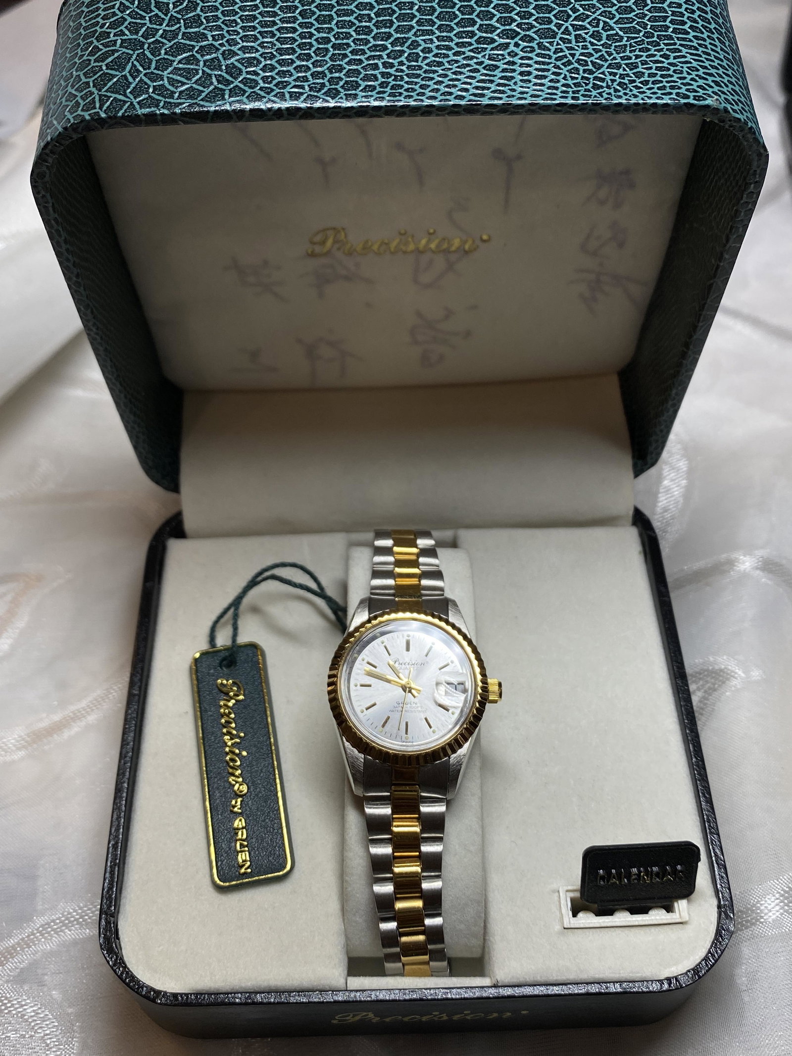 PRECISION BY GRUEN 2 TONE LADIES WATCH W/BOX: PRECISION BY GRUEN 2 TONE LADIES WATCH W/BOX. THIS IS A NEW OLD STOCK WATCH. PLEASE VIEW ALL DETAILED PICTURES. A GREAT FIND AND AN EXCELLENT ADDITION TO YOUR COLLECTION.