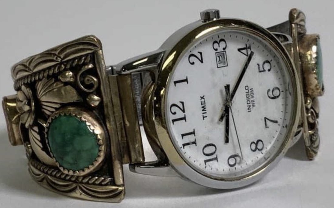 NATIVE AMERICAN NAVAJO SILVER TURQUOISE & CORAL WATCH: NATIVE AMERICAN NAVAJO SILVER TURQUOISE & CORAL WATCH. Timex watch with Navajo silver, turquoise, coral and 3 dimensional floral design. Silver is stamped VK, watch is a Timex indigo WR 30 M, stainles