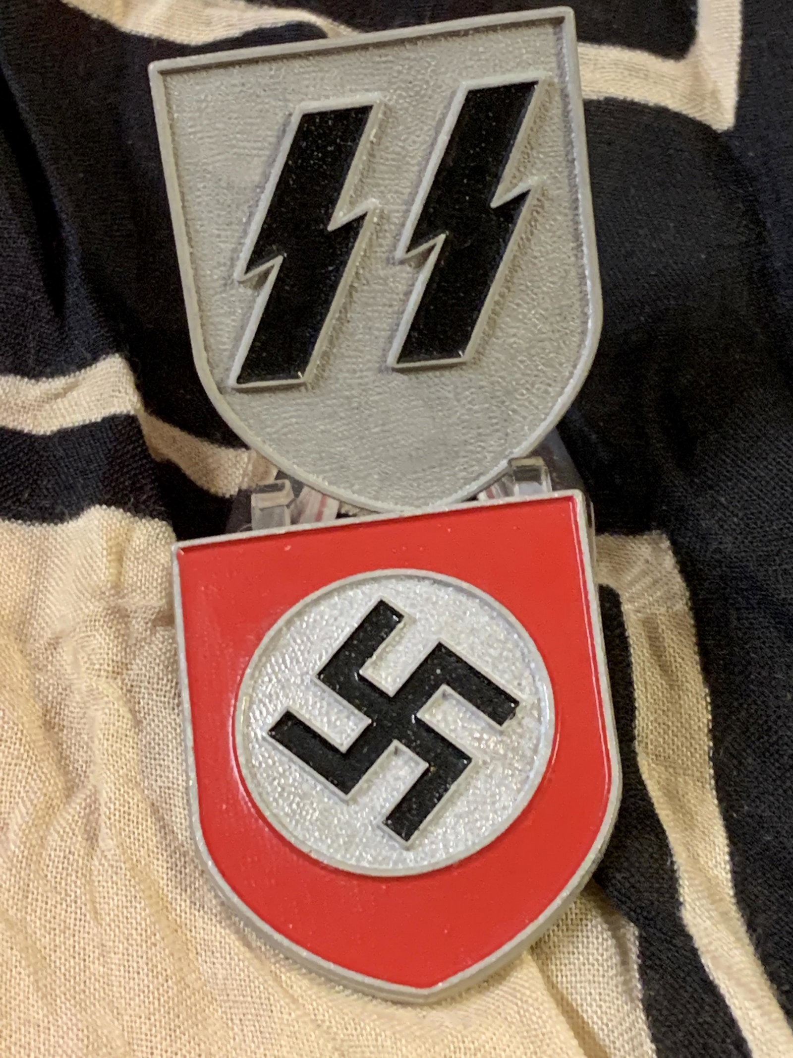 RARE WW2 GERMAN SS SET OF (2) HELMET SHIELDS: RARE WW2 GERMAN SS SET OF (2) HELMET SHIELDS. IN MINT OVERALL SHAPE AND CONDITION WITH A BEAUTIFUL OVERALL PATINA. PLEASE VIEW ALL DETAILED PICTURES. THE SHIELDS HAVE THE MAKER MARKS ON THE BACK. A GR