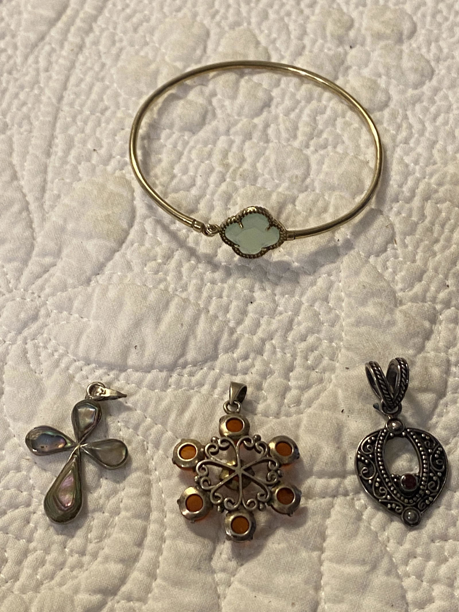 ESTATE LOT OF (3) STERLING SILVER PENDANTS & BRACELET: ESTATE LOT OF (3) STERLING SILVER PENDANTS & BRACELET. IN MINT OVERALL SHAPE AND CONDITION. WE ARE NOT SURE IF THE BRACELET IS GOLD, GOLD FILLED, ETC. SOLD AS FOUND. PLEASE VIEW ALL DETAILED PICTURES.