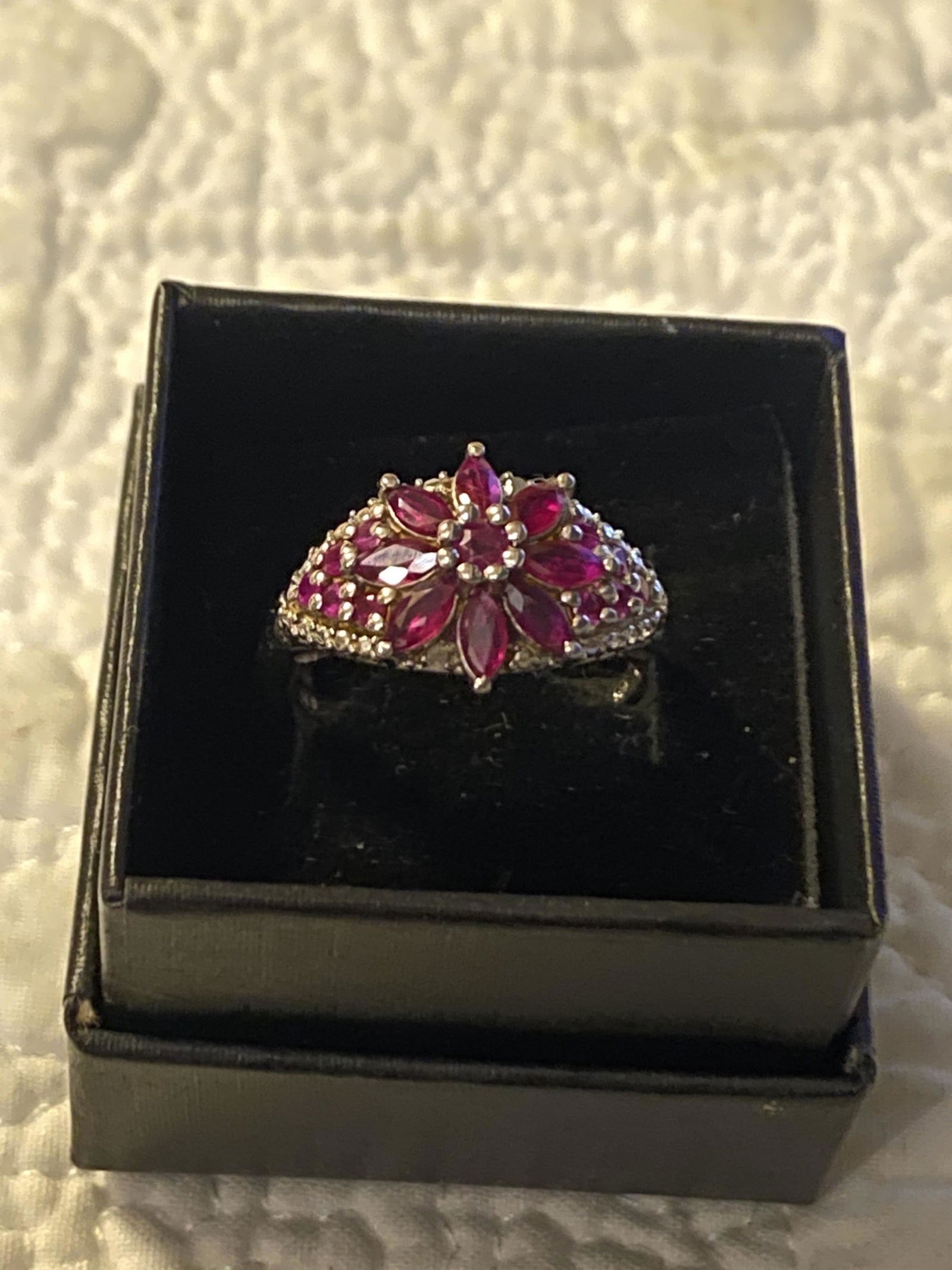 DESIGNER STERLING SILVER RUBY COCTAIL FLORAL RING: DESIGNER STERLING SILVER RUBY COCTAIL FLORAL RING. IN GOOD OVERALL SHAPE AND CONDITION. RING IS A SIZE 8. A GREAT FIND AND AN EXCELLENT ADDITION TO YOUR COLLECTION.