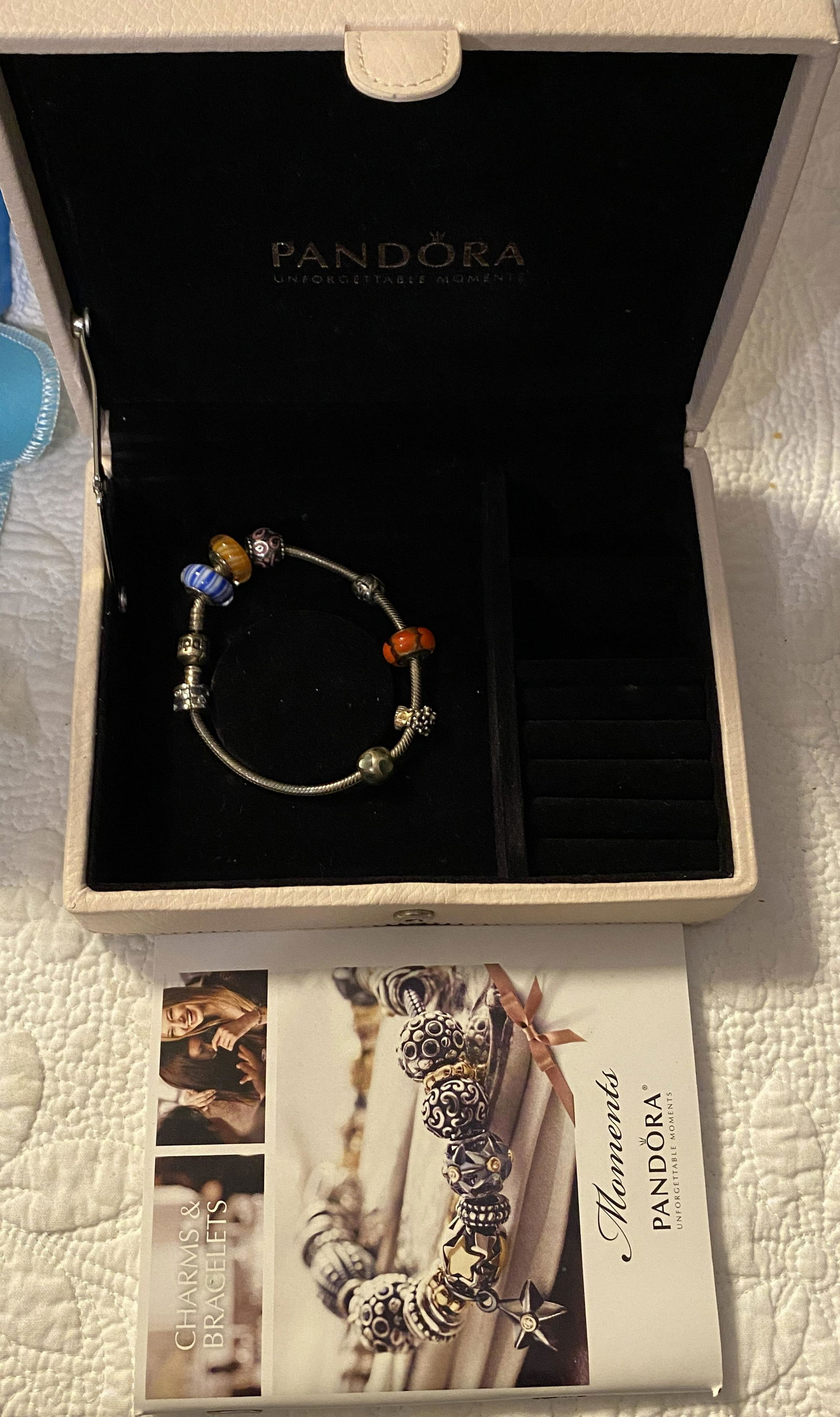 PANDORA LADIES STERLING SILVER CHARM BRACELET: PANDORA LADIES STERLING SILVER CHARM BRACELET. IN GOOD OVERALL SHAPE AND CONDITION. COMES IN THE ORIG. PANDORA BOX. PLEASE VIEW ALL DETAILED PICTURES. A GREAT FIND AND AN EXCELLENT ADDITION TO YOUR CO