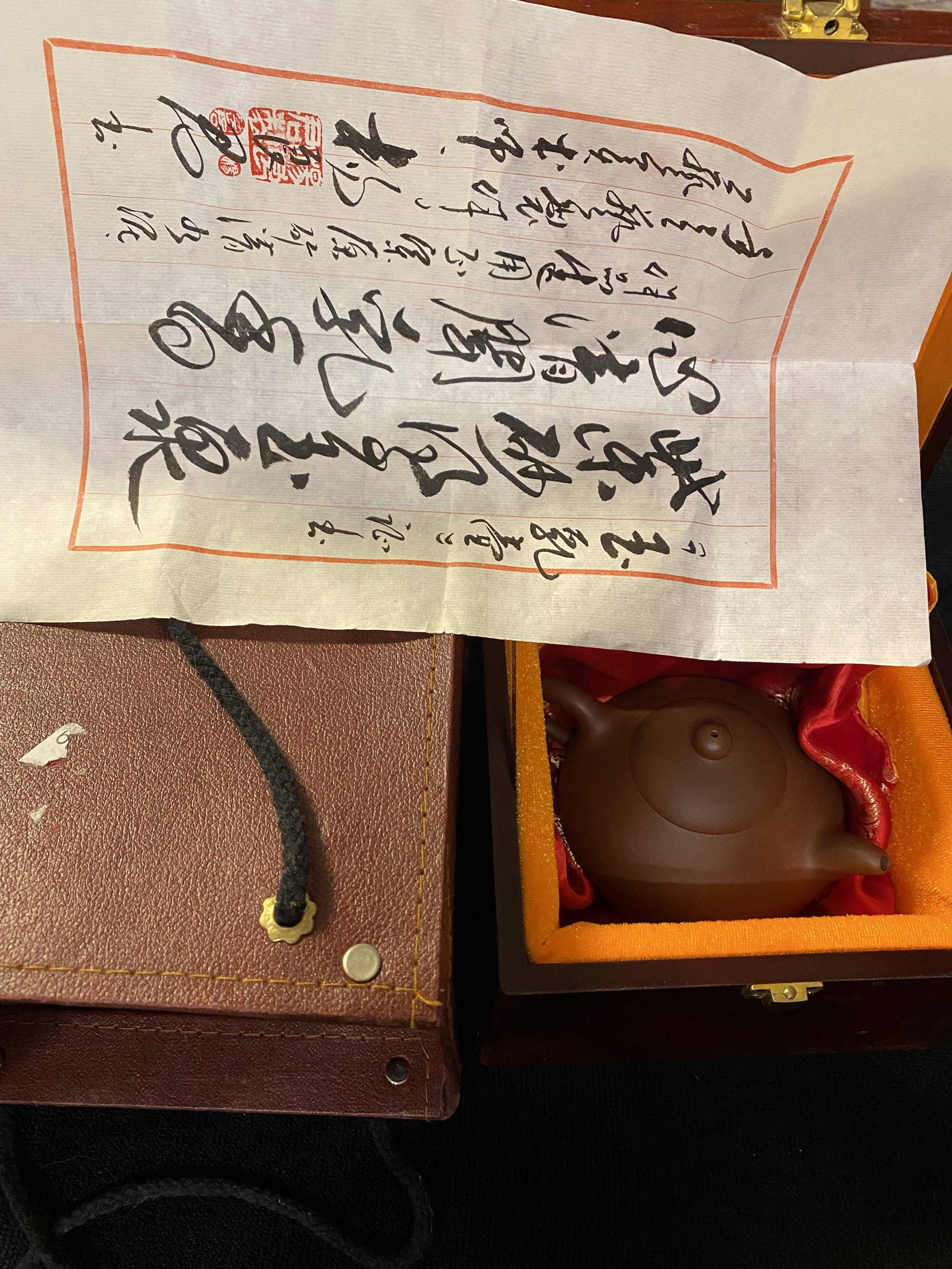 YIXING CHA TEAPOT IN ORIG. CHERRY WOOD BOX: This beautiful little Yixing Cha Teapot in its original Cherry Wood Box and is marked on top of the box "Zun Gui Ming Pin". Yixing Cha Teapots are made of special clay, which is composed of coarse par