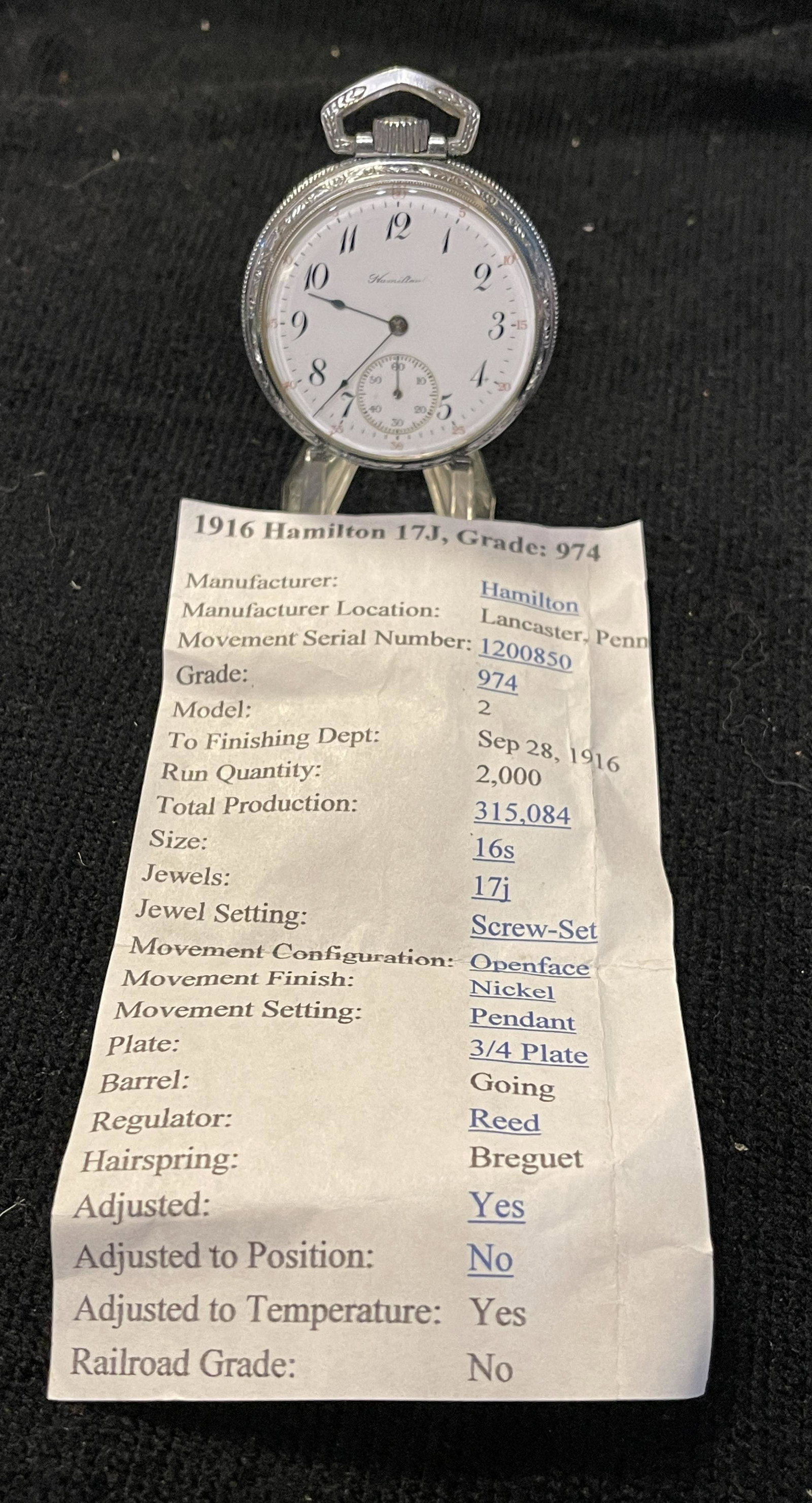 1916 HAMILTON 17J, GRADE 974 RAILROAD MOTIF POCKET: 1916 HAMILTON 17J, GRADE 974 RAILROAD MOTIF POCKET WATCH. IN GOOD WORKING ORDER. HAS A BEAUTIFUL ENGRAVED TRAIN MOTIF ON THE BACK CASE. BEAUTIFUL CLEAN RUNNING MOVEMENT. PLEASE VIEW PICTURES FOR SPECI