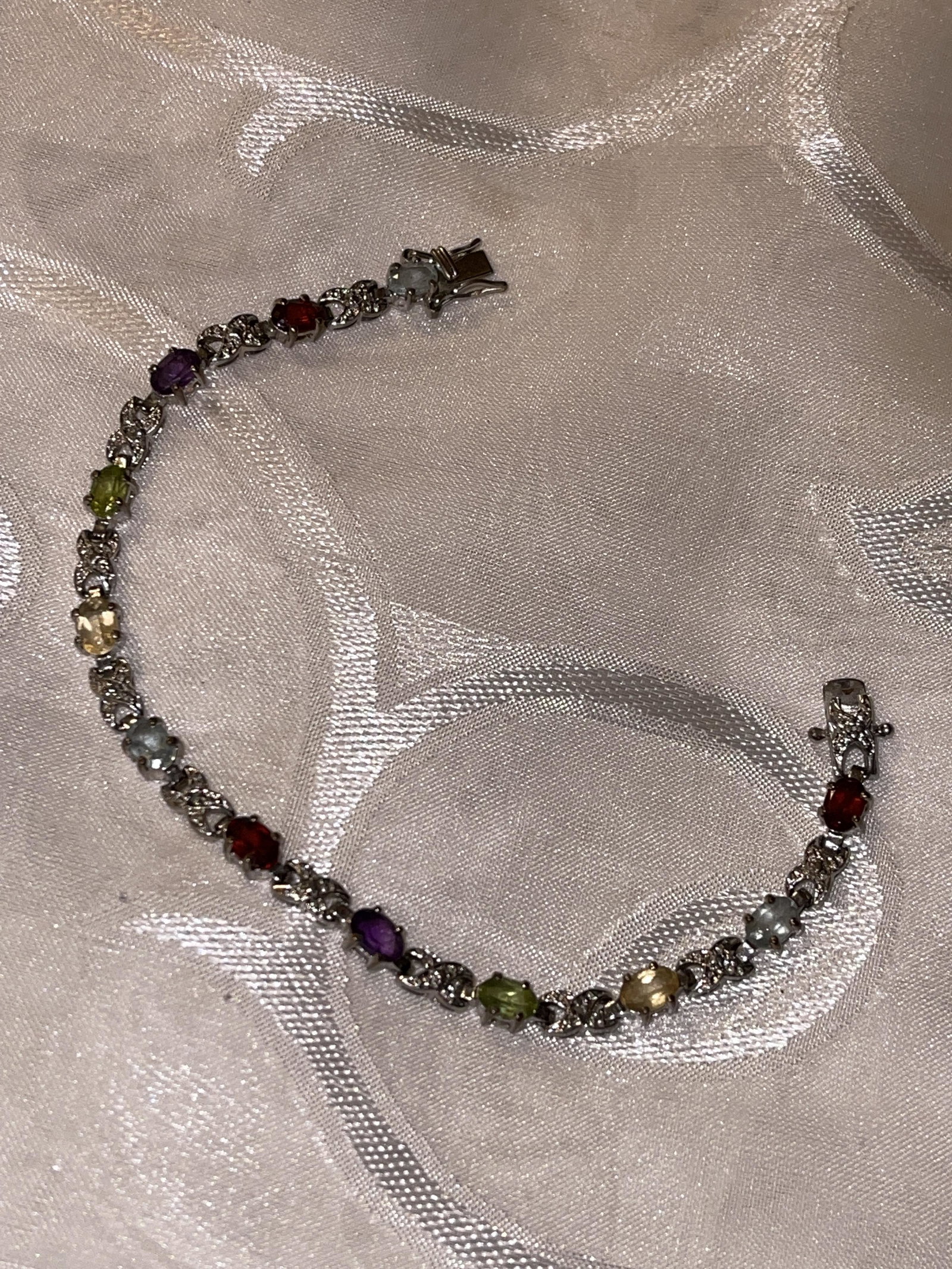 STERLING SILVER MULTI-GEMSTONE COCKTAIL TENNIS BRACELET: STERLING SILVER MULTI-GEMSTONE COCKTAIL TENNIS BRACELET. IN GOOD OVERALL SHAPE AND CONDITION. A GREAT FIND AND AN EXCELLENT ADDITION TO YOUR COLLECTION.