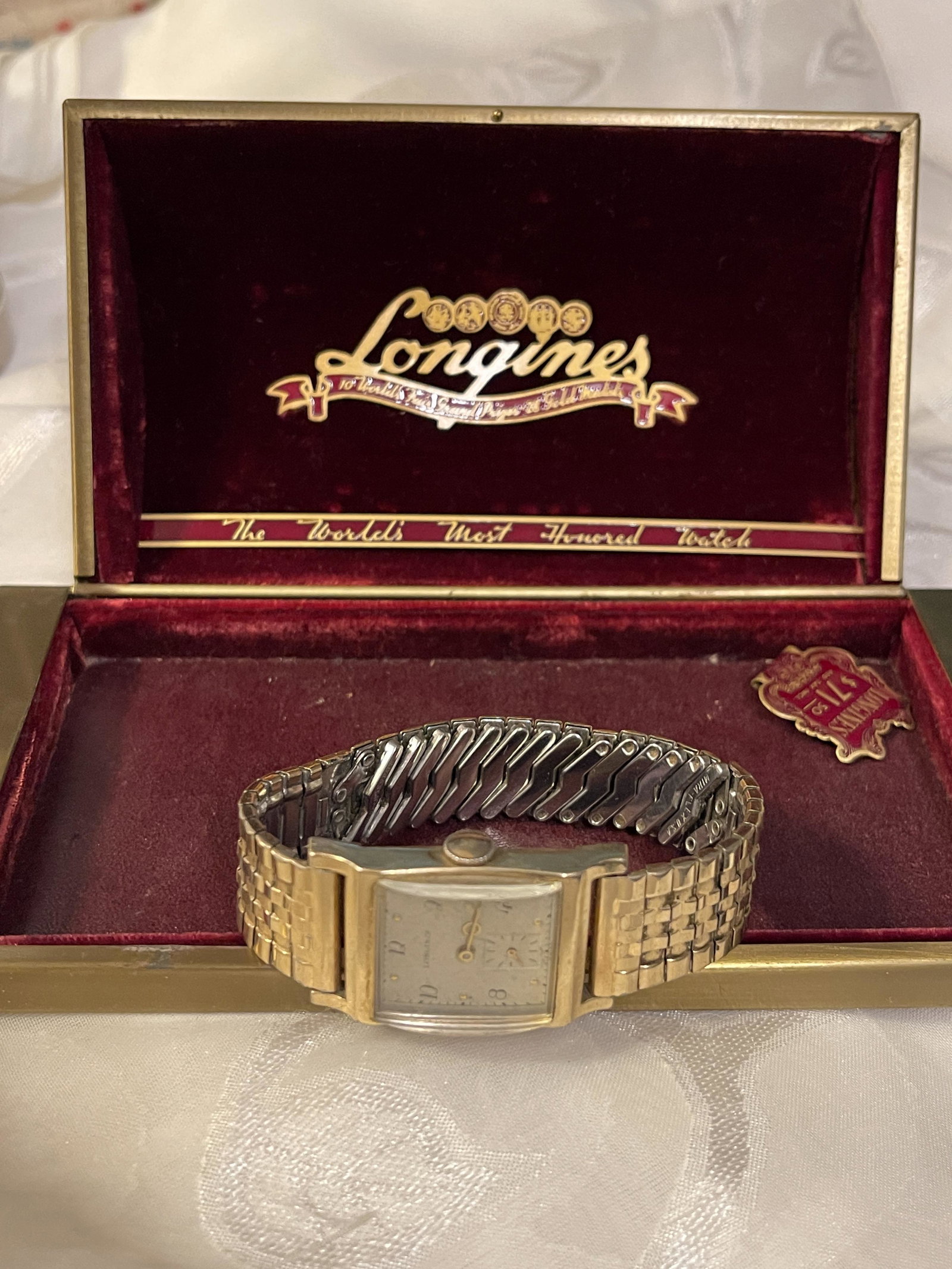 VINTAGE LONGINES HAND WINDING WATCH W/ORIG. BOX: VINTAGE LONGINES HAND WINDING WATCH W/ORIG. BOX. WATCH COMES WITH BOX, AND ORIG. STICKER PRICE TAG.
