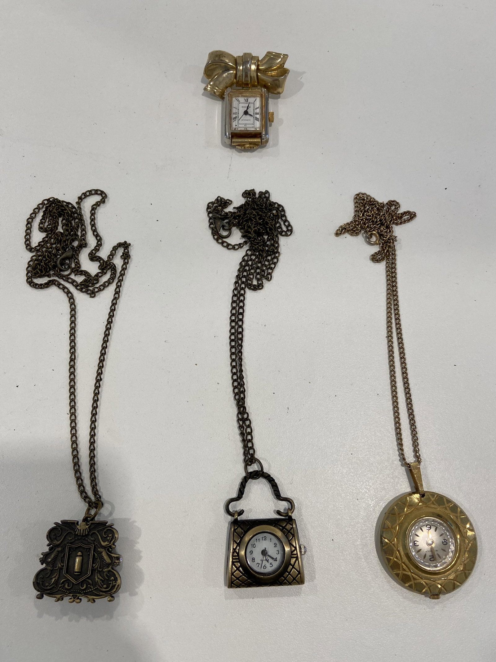 LOT OF (4) ESTATE LADIES PENDANT WATCHES: LOT OF (4) ESTATE LADIES PENDANT WATCHES. SOLD AS A LOT. ALL FOR ONE MONEY.