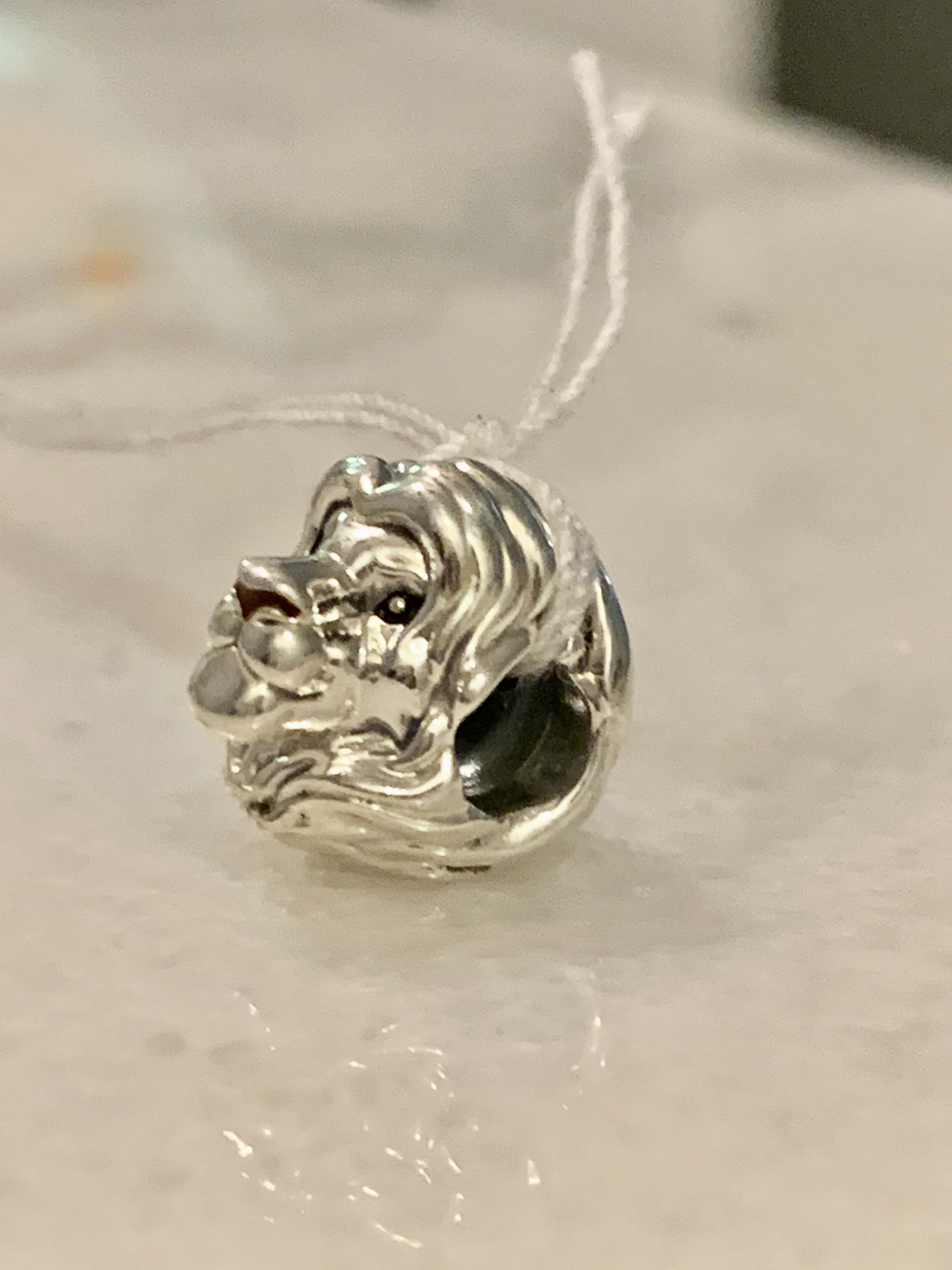 STERLING SILVER LION KING PANDORA CHARM: STERLING SILVER LION KING PANDORA CHARM. IN GOOD OVERALL SHAPE AND CONDITION. A GREAT FIND AND AN EXCELLENT ADDITION TO YOUR COLLECTION.