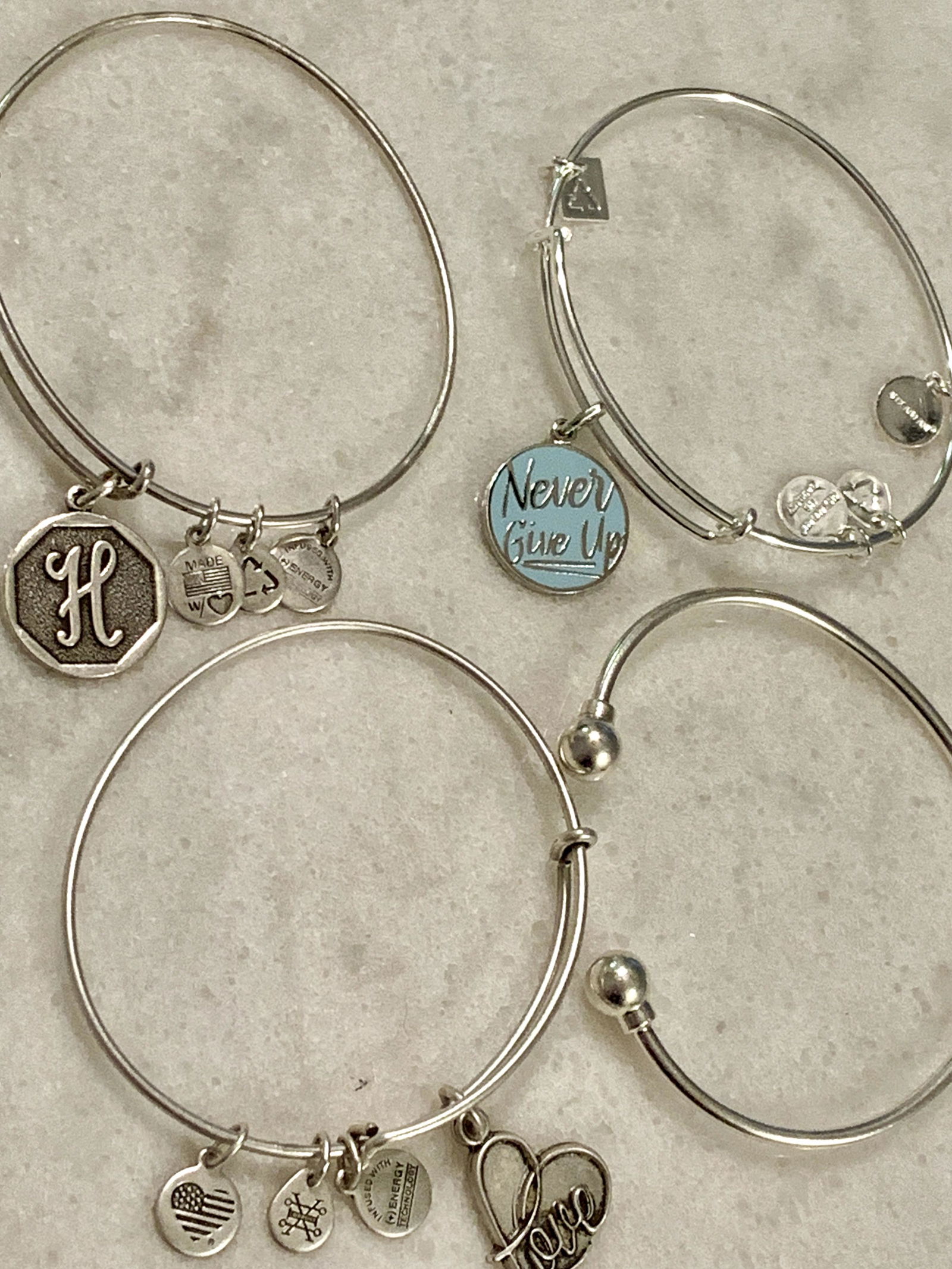 COLLECTION LOT OF (4) LADIES CHARM BRACELETS: COLLECTION LOT OF (4) LADIES CHARM BRACELETS. A GREAT FIND AND AN EXCELLENT ADDITION TO YOUR COLLECTION.