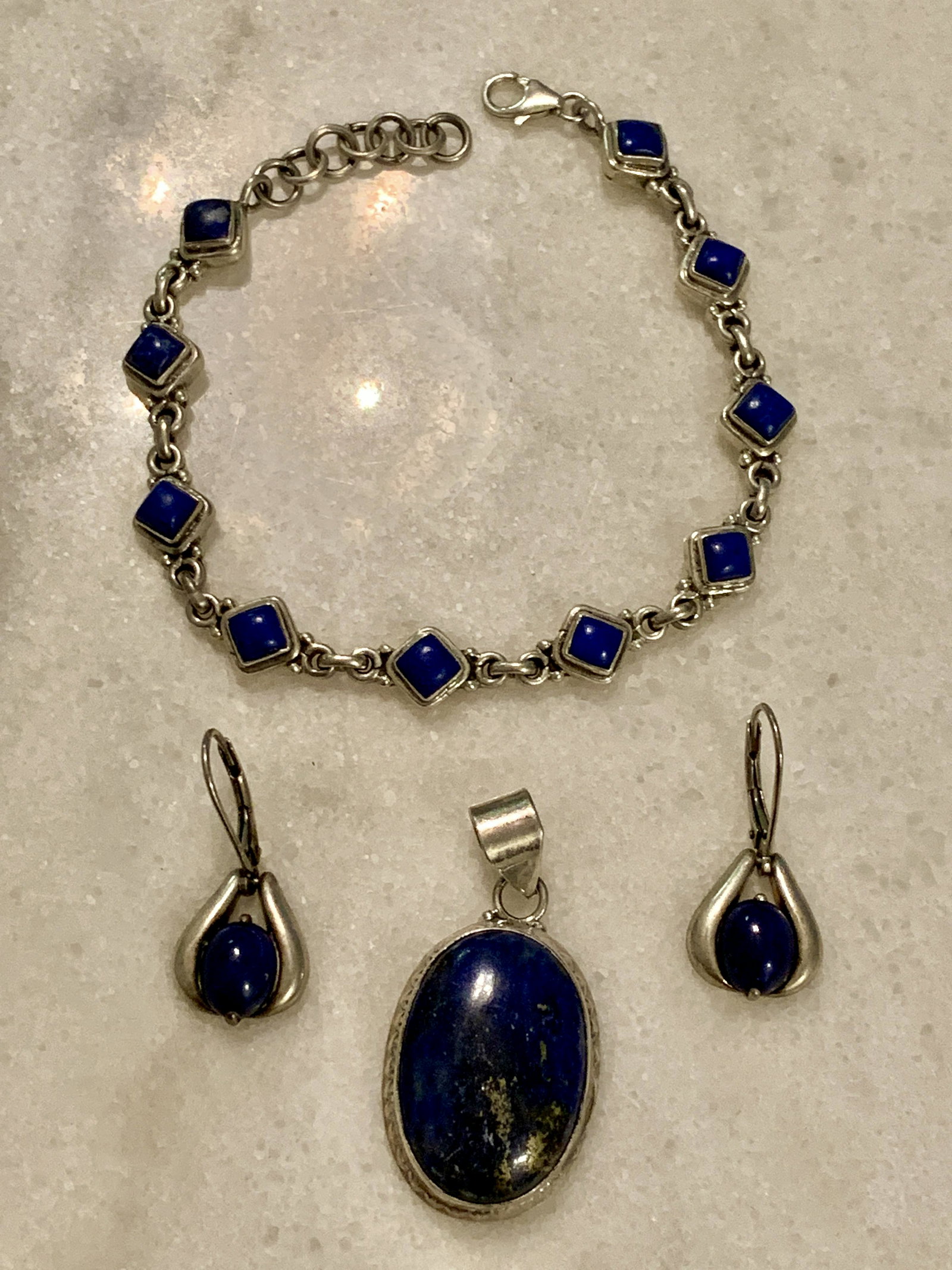 COLLECTION LOT OF STERLING SILVER LAPIS LAZULI JEWELRY: COLLECTION LOT OF STERLING SILVER LAPIS LAZULI JEWELRY. INCLUDES 3 PENDANTS AND A TENNIS BRACELET. ALL ARE STERLING SILVER. A GREAT FIND AND AN EXCELLENT ADDITION TO YOUR COLLECTION.