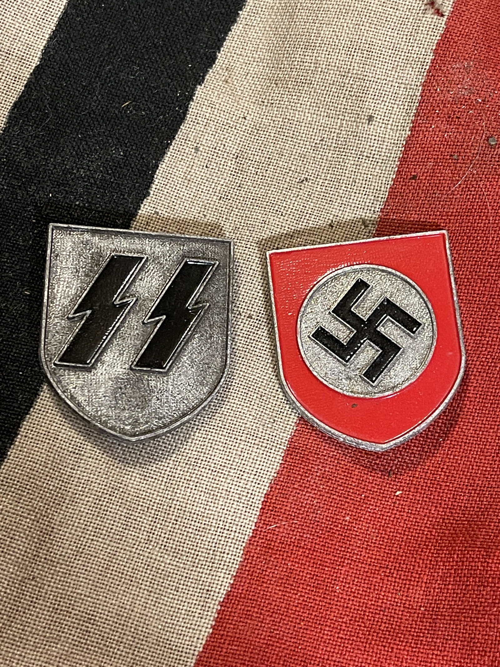 COLLECTION SET OF (2) WW2 GERMAN SS HELMET SHIELD: COLLECTION SET OF (2) WW2 GERMAN SS HELMET SHIELD BADGES. HAS THE MAKER MARKS ON THE BACK. PLEASE VIEW ALL DETAILED PICTURES. A GREAT ADDITION TO YOUR COLLECTION.