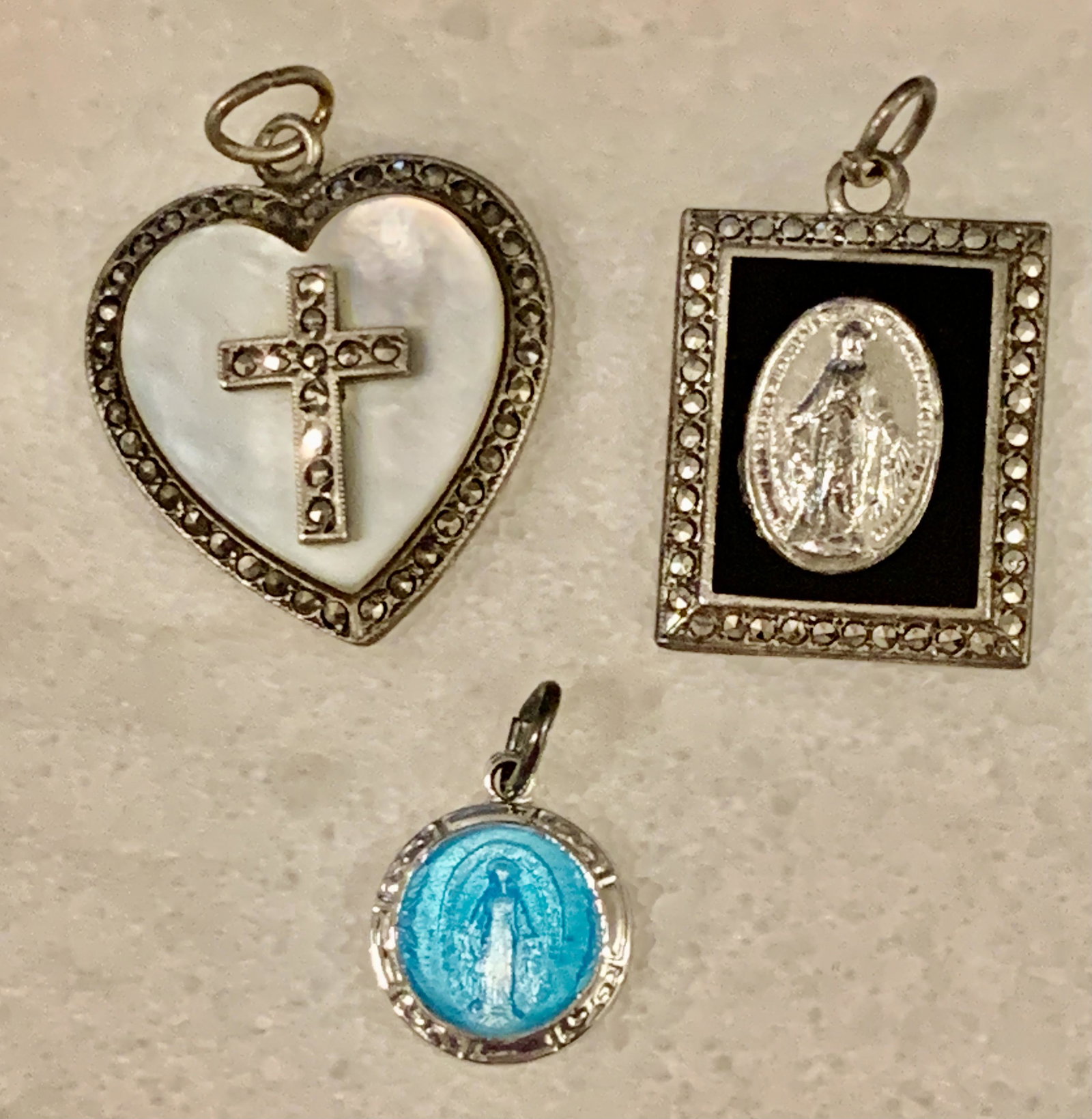 STERLING SILVER LOT OF (3) CROSS PRAYER PENDANTS: STERLING SILVER LOT OF (3) CROSS PRAYER PENDANTS. SOLD AS A LOT! ALL FOR ONE MONEY! PLEASE VIEW PICTURES.
