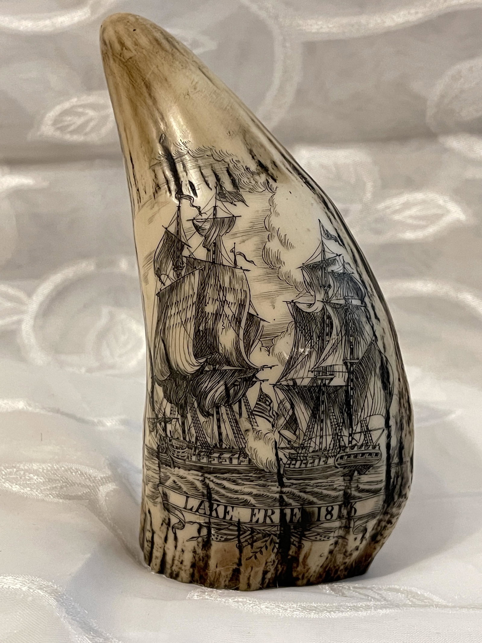 ANTIQUE LAKE ERIE 1813 SCRIMSHAW TOOTH DESK ORNAMENT: ANTIQUE LAKE ERIE 1813 SCRIMSHAW TOOTH DESK ORNAMENT. IN MINT OVERALL SHAPE AND CONDITION. BEAUTIFUL DETAILED ENGRAVING WITH EXCELLENT OVERALL CRAFTSMANSHIP. PLEASE VIEW ALL DETAILED PICTURES. A GREAT