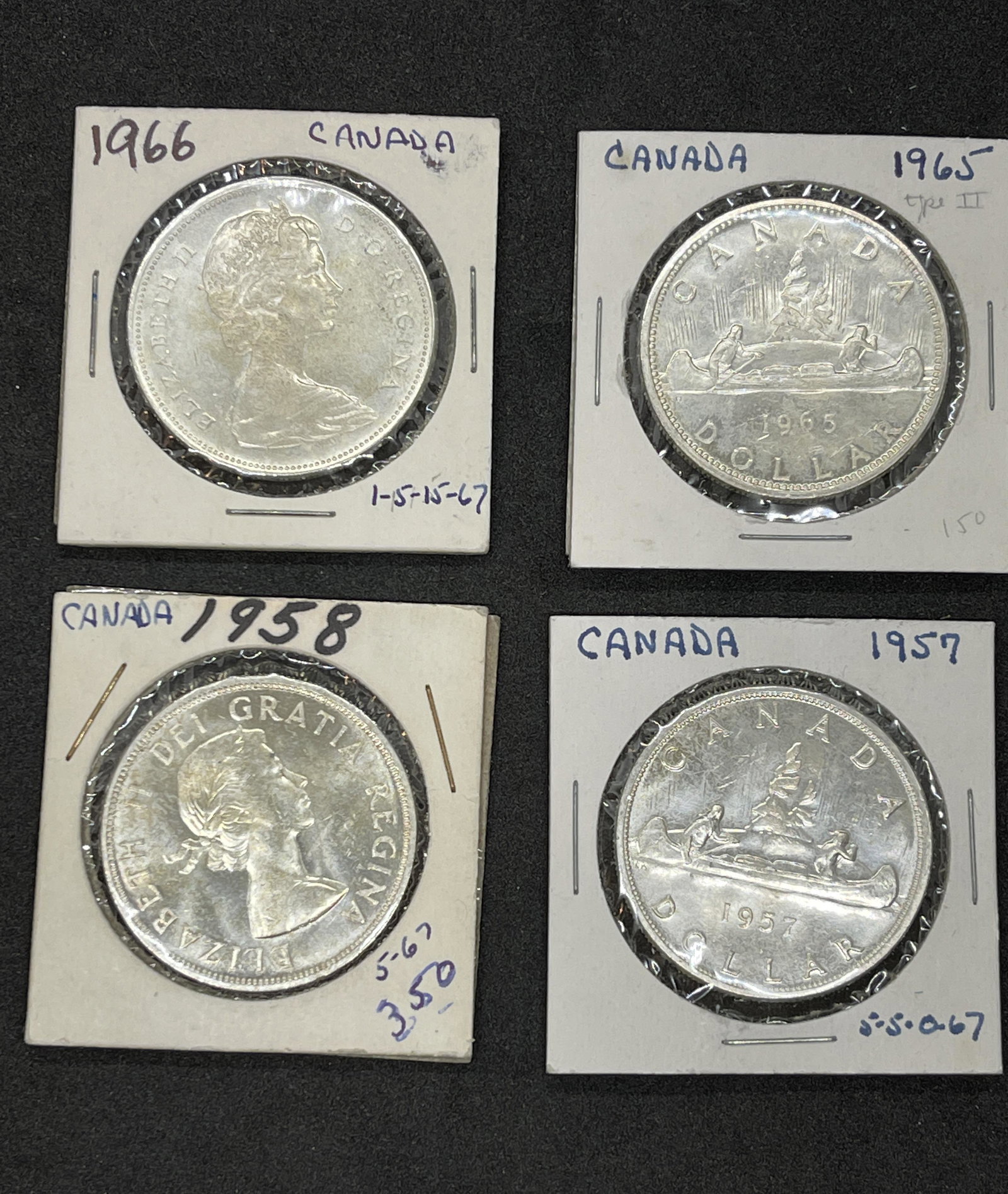 COLLECTION LOT OF (4) CANADIAN SILVER DOLLARS: COLLECTION LOT OF (4) CANADIAN SILVER DOLLARS. SOLD AS A LOT - ALL FOR ONE MONEY!