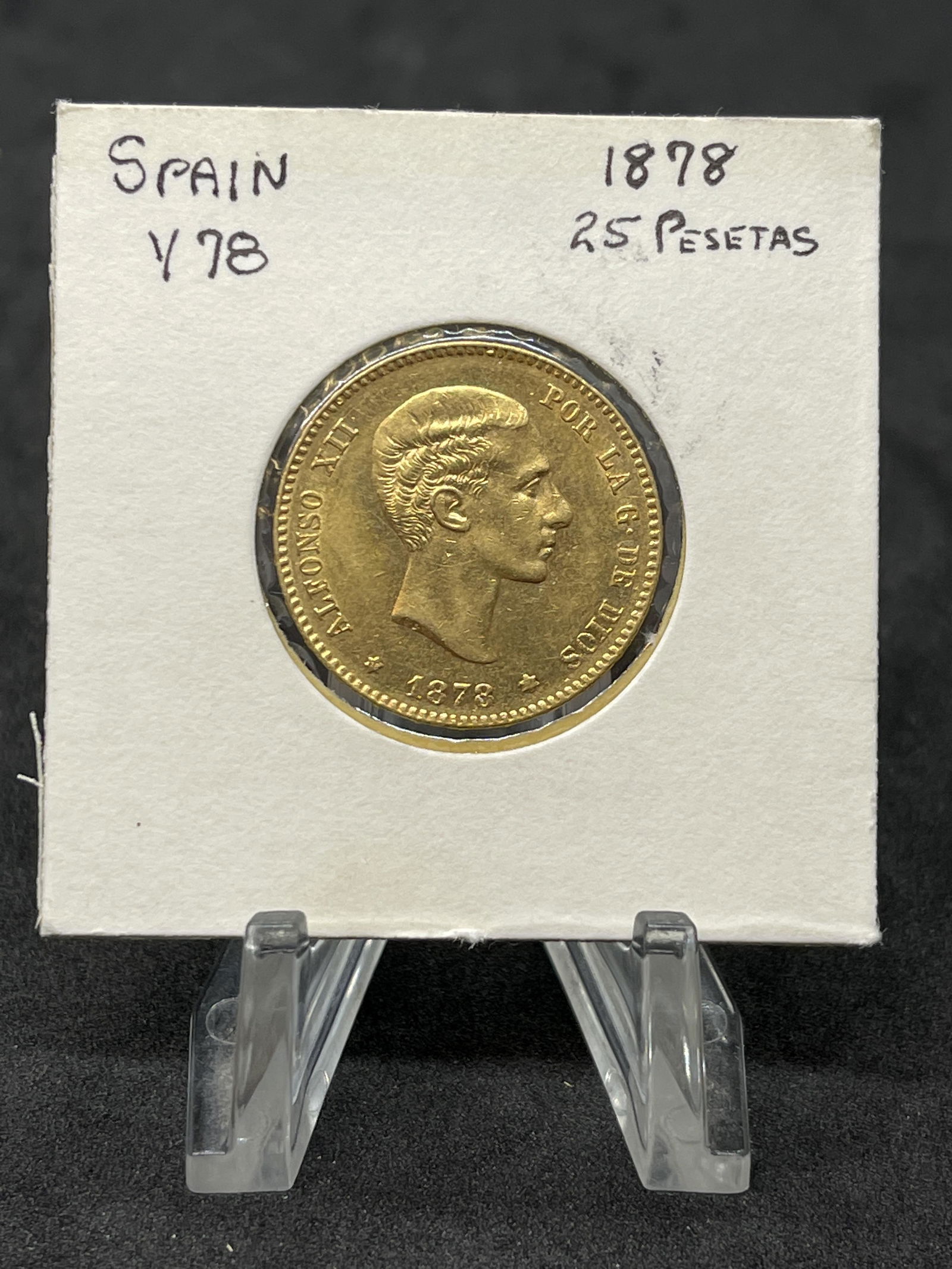 1878 SPAIN 25 PESETAS GOLD COIN: 1878 SPAIN 25 PESETAS GOLD COIN. IN EXCEPTIONAL OVERALL SHAPE AND CONDITION. PLEASE VIEW ALL DETAILED PICTURES. A GREAT FIND AND AN EXCELLENT ADDITION TO YOUR COLLECTION.