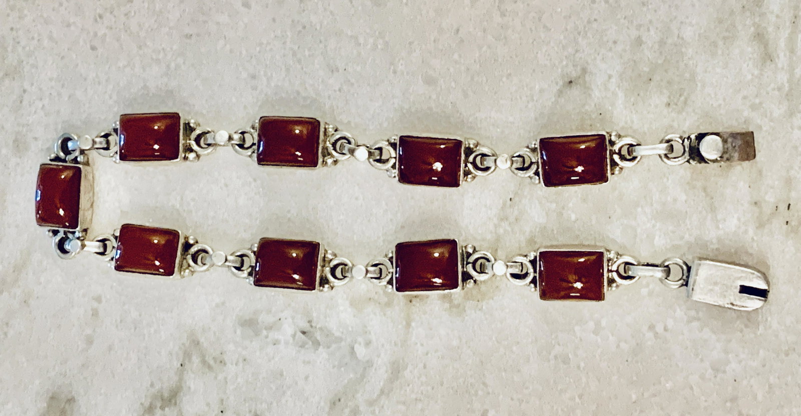 OLD STERLING SILVER RED GEMSTONES COCKTAIL BRACELET: OLD STERLING SILVER RED GEMSTONES COCKTAIL BRACELET. IN GOOD OVERALL SHAPE AND CONDITION. HAS A GREAT LOOK TO IT WITH AN EXCELLENT OVERALL EYE APPEAL. A GREAT FIND AND AN EXCELLENT ADDITION TO YOUR CO