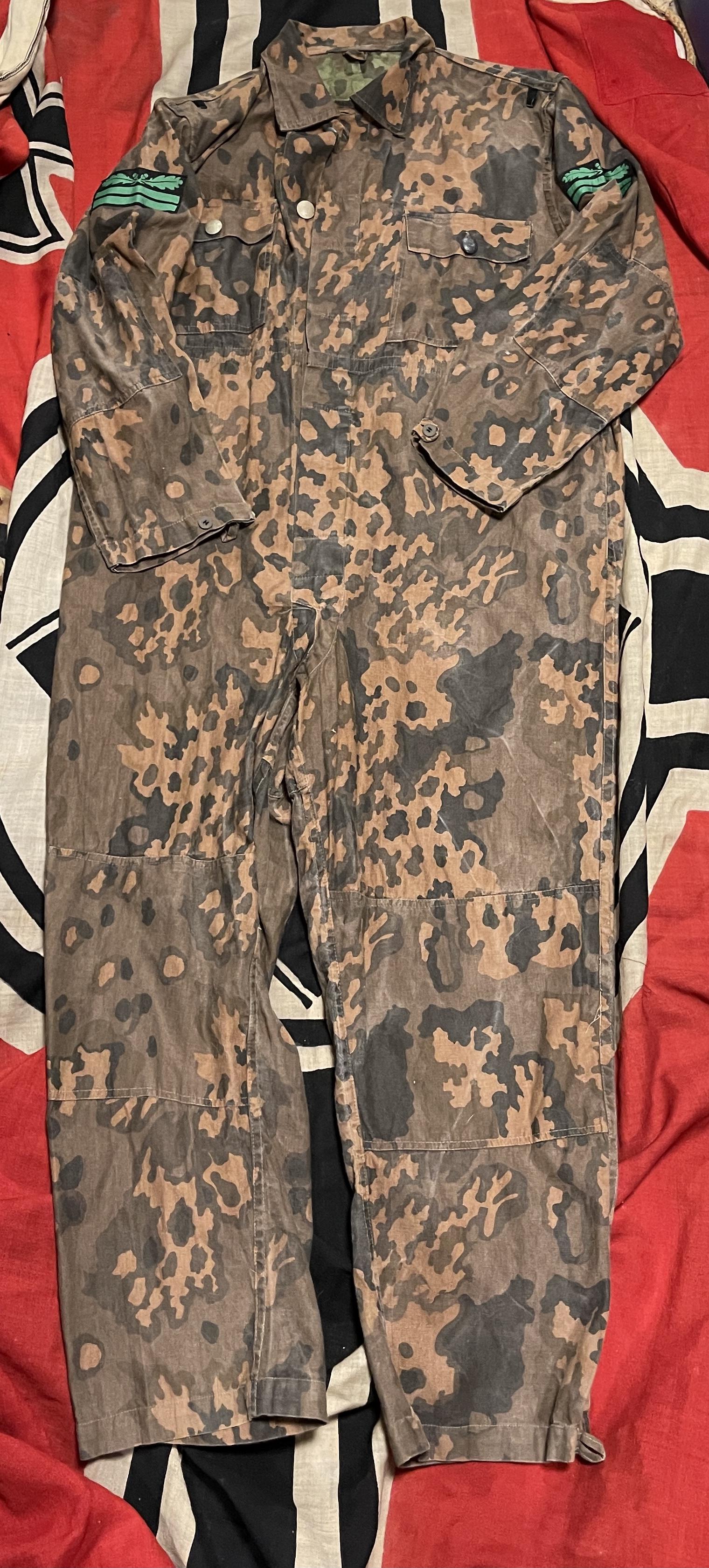 RARE WW2 GERMAN SS PANZER KOMBI CAMO JUMPSUIT: RARE WW2 GERMAN SS PANZER KOMBI CAMO JUMPSUIT. IN MINT OVERALL SHAPE AND CONDITION. HAS A GREAT LOOK TO IT WITH AN EXCELLENT OVERALL EYE APPEAL. This version of the Panzer "Kombi", a reversible covera