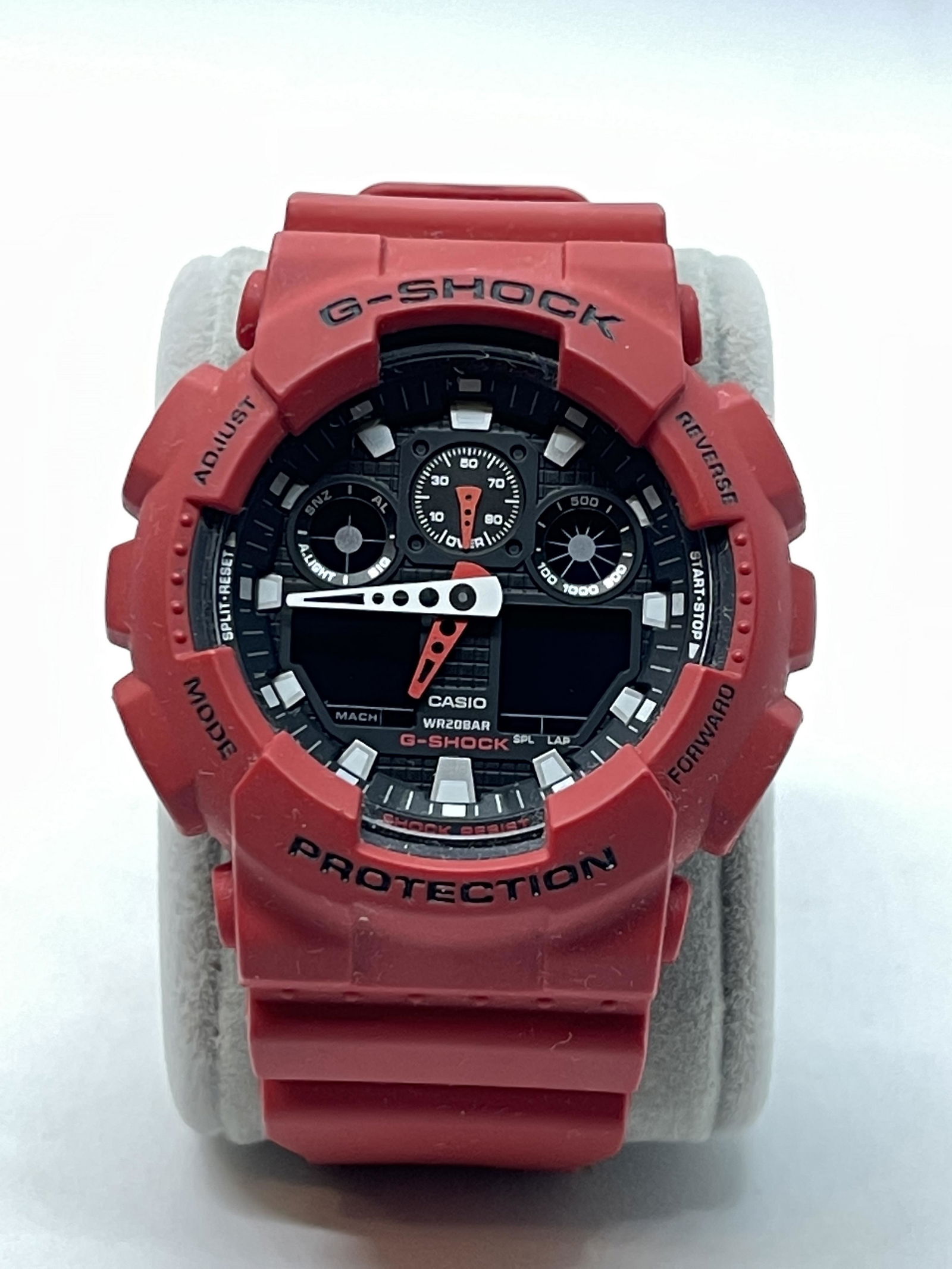 CASIO G-SHOCK RED GA-100B WRISTWATCH: CASIO G-SHOCK RED GA-100B WRISTWATCH. IN MINT OVERALL SHAPE AND CONDITION. HAS A GREAT LOOK TO IT WITH AN EXCELLENT OVERALL EYE APPEAL. A GREAT FIND AND AN EXCELLENT ADDITION TO YOUR COLLECTION.