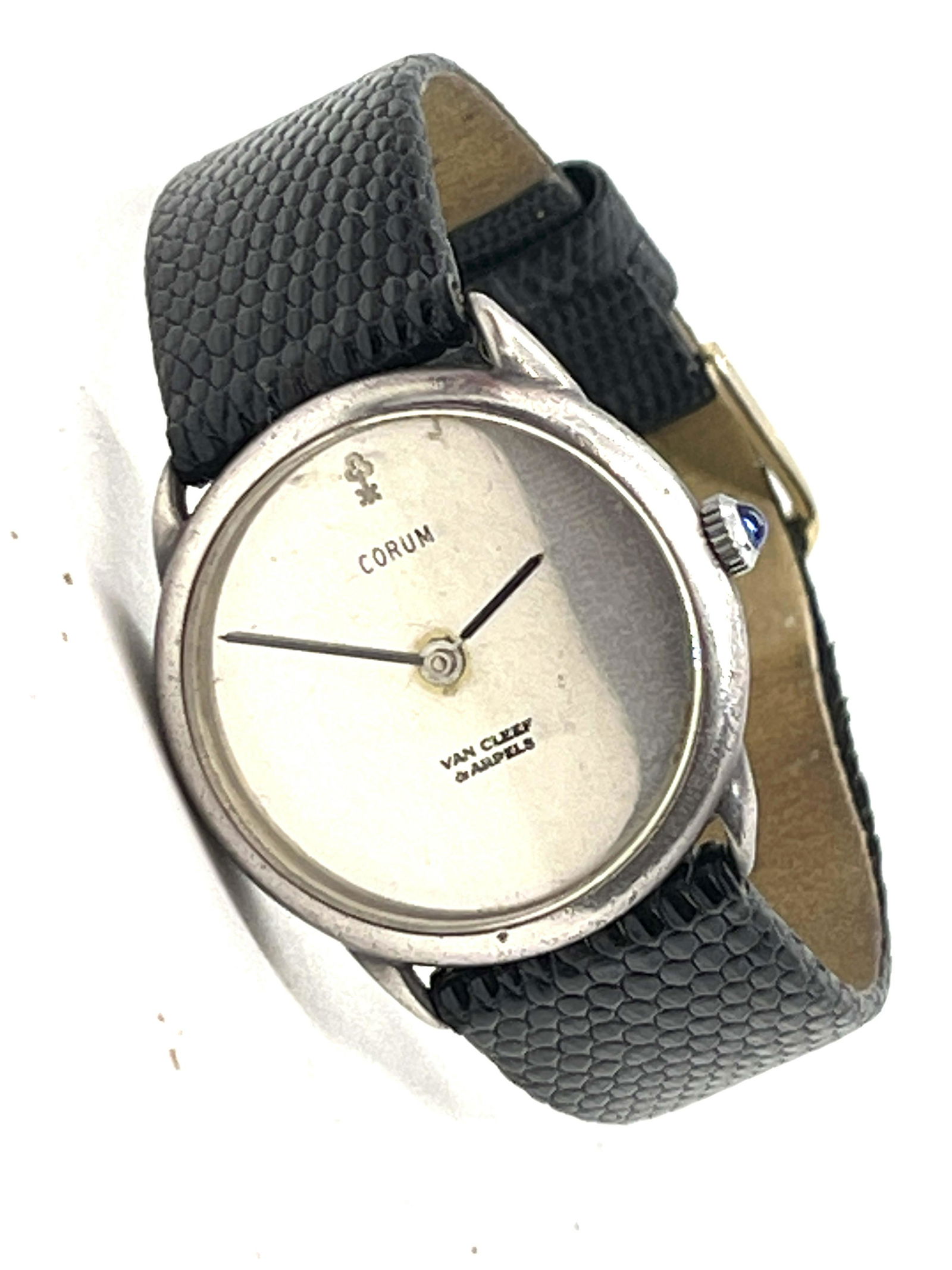 RARE CORUM VAN CLEEF STERLING SILVER WRISTWATCH: RARE CORUM VAN CLEEF STERLING SILVER WRISTWATCH. THIS IS A RARE FIND. IT IS IN MINT OVERALL SHAPE AND CONDITION. RUNS AND KEEPS GOOD TIME. A VERY RARE FIND. MADE OUT OF STERLING SILVER. MADE BY CORUM