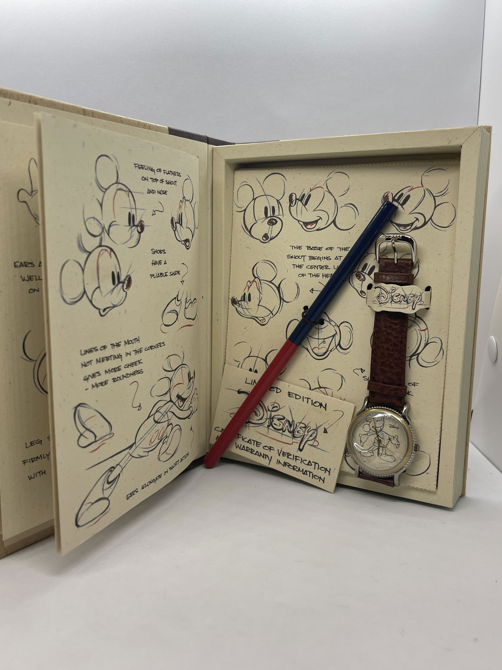 VTG. SKETCHES OF MICKEY MOUSE WRISTWATCH IN BOOK CASE (1 of 5)