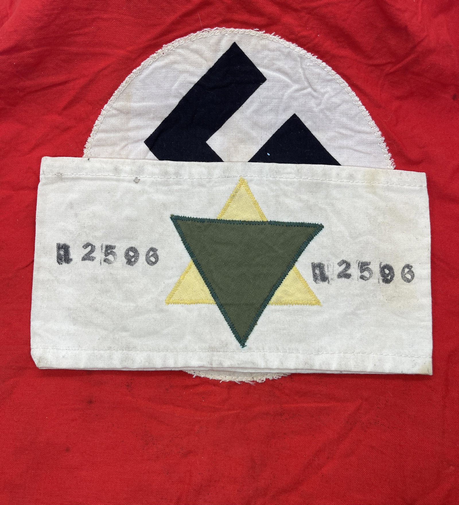 PRISON #'D WW2 GERMAN DACHAU CONCENTRATION CAMP ARMBAND: PROSONER NUMBERED WW2 GERMAN DACHAU CONCENTRATION CAMP ARMBAND. THIS IS AN EXTREMELY RARE FIND. IT IS IN MINT OVERALL SHAPE AND CONDITION WITH A BEAUTIFUL OVERALL PATINA. HAS A GREAT LOOK TO IT WITH A