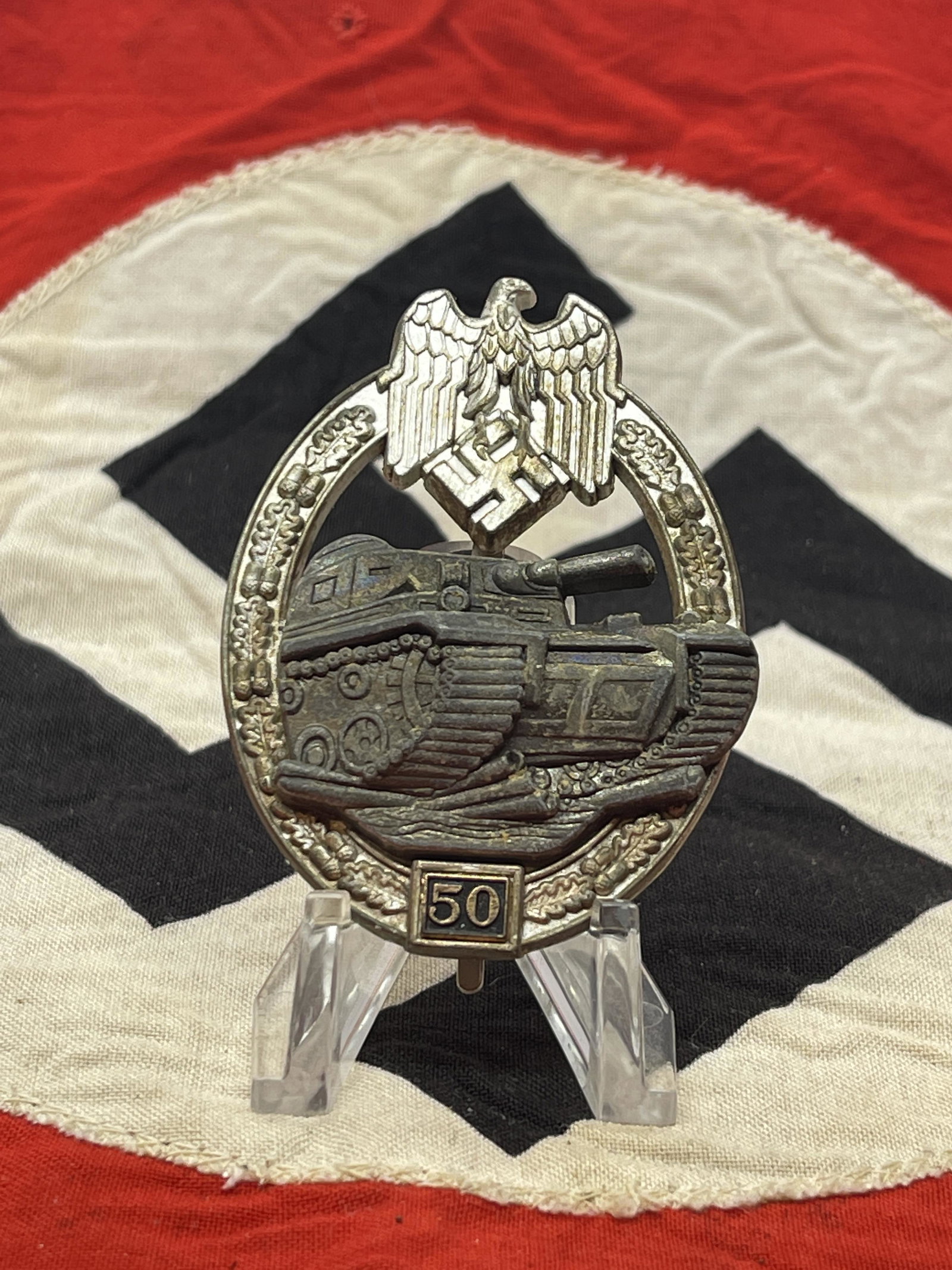 50 ENGAGEMENTS WW2 GERMAN PANZER ASSAULT BADGE BY JFS: 50 ENGAGEMENTS WW2 GERMAN PANZER ASSAULT BADGE BY JFS. MARKED JFS ON THE BACK. IT IS IN MINT OVERALL SHAPE AND CONDITION WITH A BEAUTIFUL OVERALL PATINA. HAS A GREAT LOOK TO IT WITH AN EXCELLENT OVERA