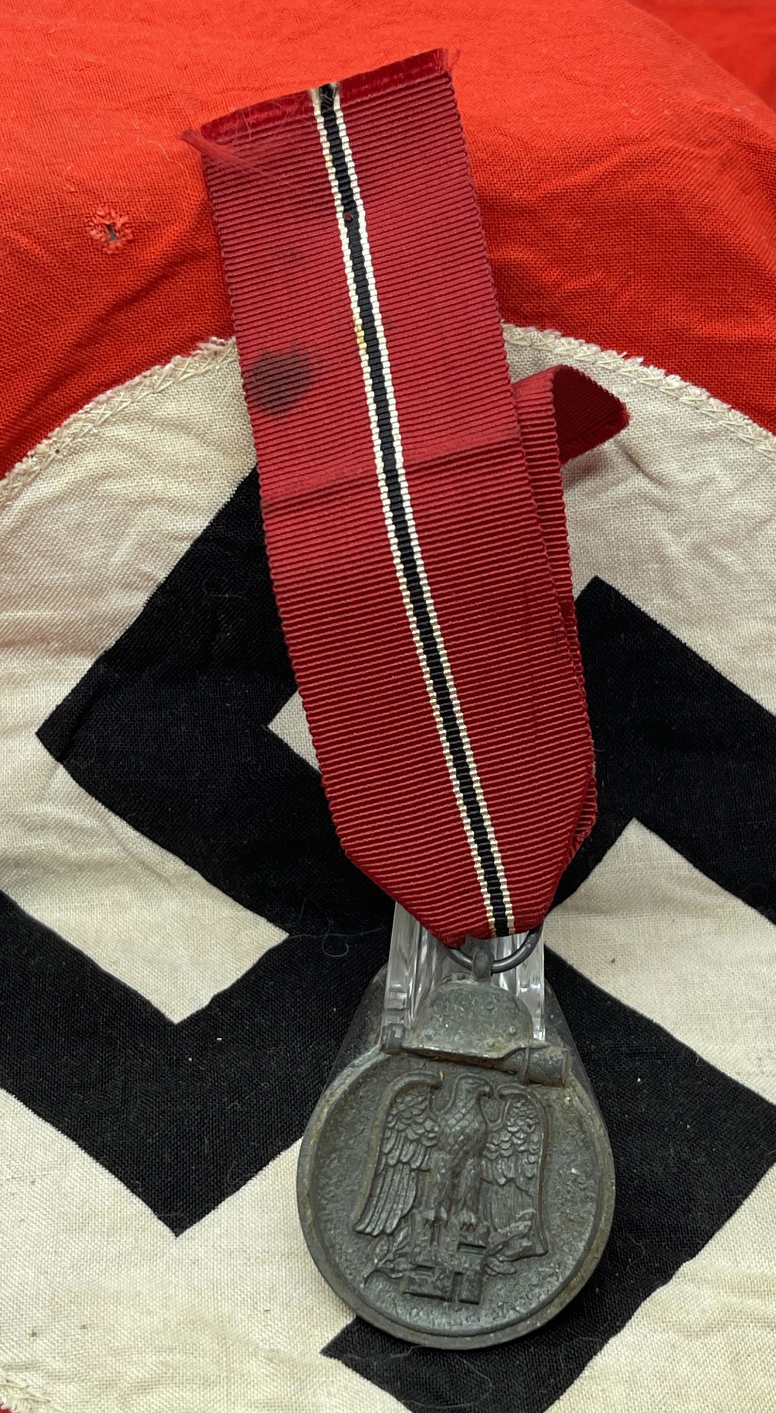 WW2 GERMAN NAZI MEDAL FOR EASTERN FRONT W/RIBBON: WW2 GERMAN NAZI MEDAL FOR EASTERN FRONT W/RIBBON. IN MINT OVERALL SHAPE AND CONDITION WITH A BEAUTIFUL OVERALL PATINA. HAS A GREAT LOOK TO IT WITH AN EXCELLENT OVERALL EYE APPEAL. A GREAT FIND AND AN