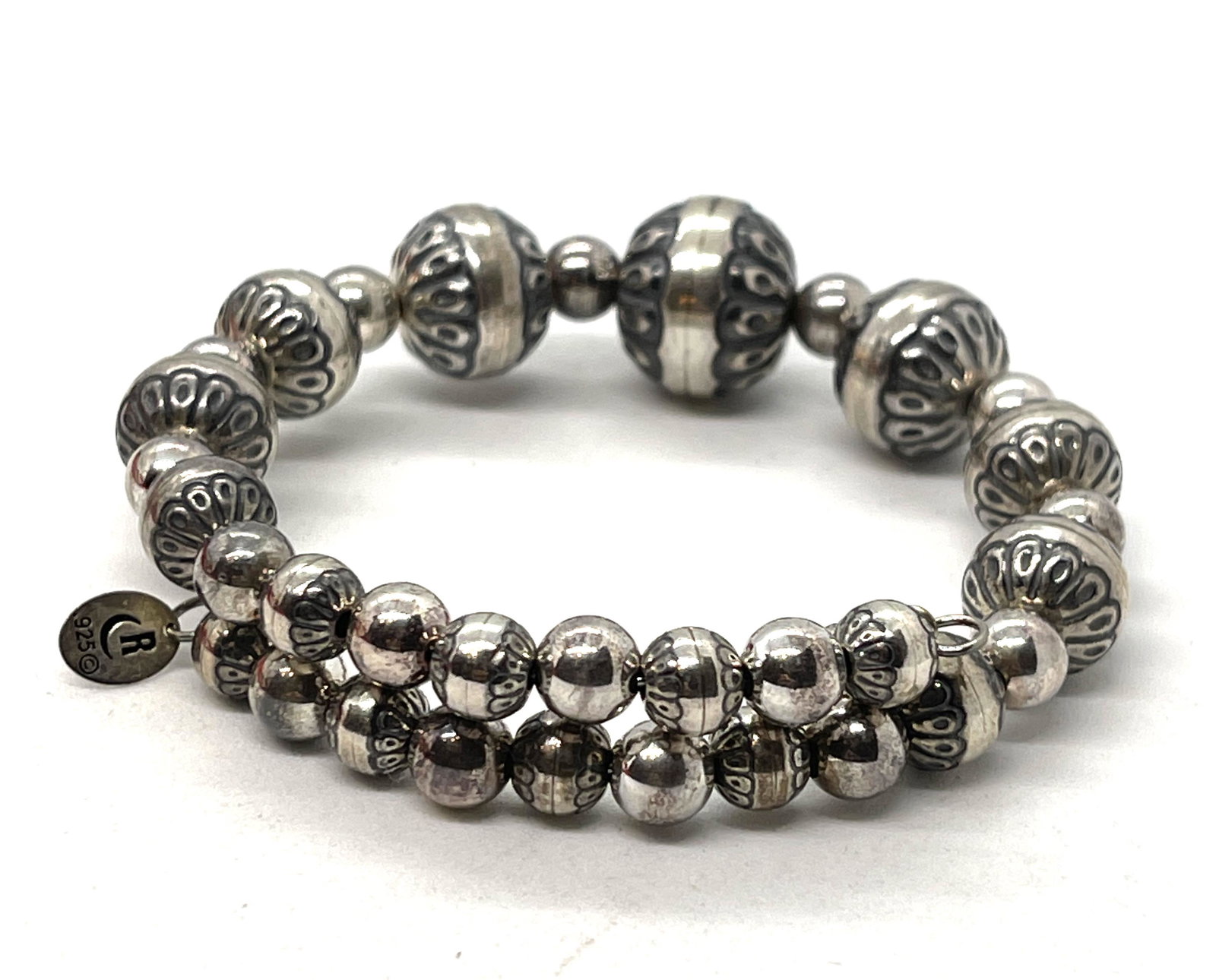 CAROLYN POLLACK STERLING SILVER BEADED COIL BRACELET: CAROLYN POLLACK STERLING SILVER BEADED COIL BRACELET. IN MINT OVERALL SHAPE AND CONDITION. A GREAT FIND AND AN EXCELLENT ADDITION TO YOUR COLLECTION.