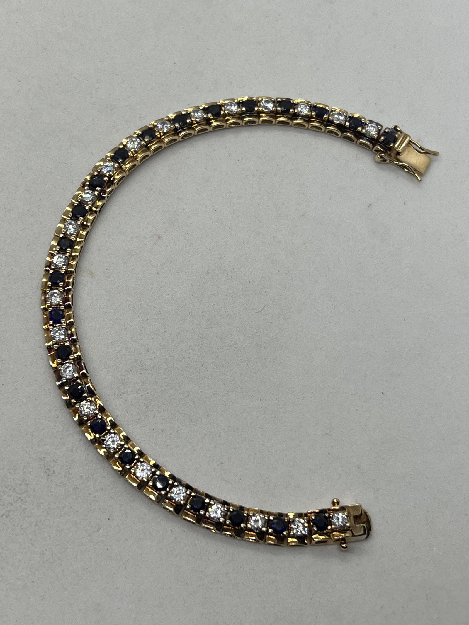 RETRO STERLING SILVER GOLD WASH BLUE/WHITE STONES: RETRO STERLING SILVER GOLD WASH BLUE/WHITE STONES TENNIS BRACELET. IN MINT OVERALL SHAPE AND CONDITION. A GREAT FIND AND AN EXCELLENT ADDITION TO YOUR COLLECTION.