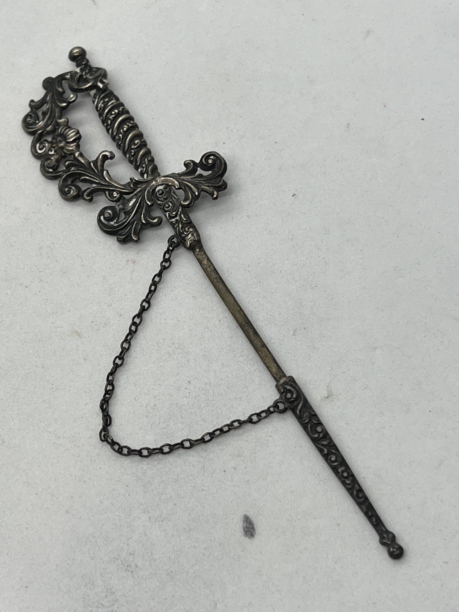 VICTORIAN STERLING SILVER MINIATURE SWORD W/SHEATH: VICTORIAN STERLING SILVER MINIATURE SWORD W/SHEATH. IN MINT OVERALL SHAPE AND CONDITION. HAS A GREAT LOOK TO IT WITH AN EXCELLENT OVERALL EYE APPEAL. A GREAT FIND AND AN EXCELLENT ADDITION TO YOUR COL
