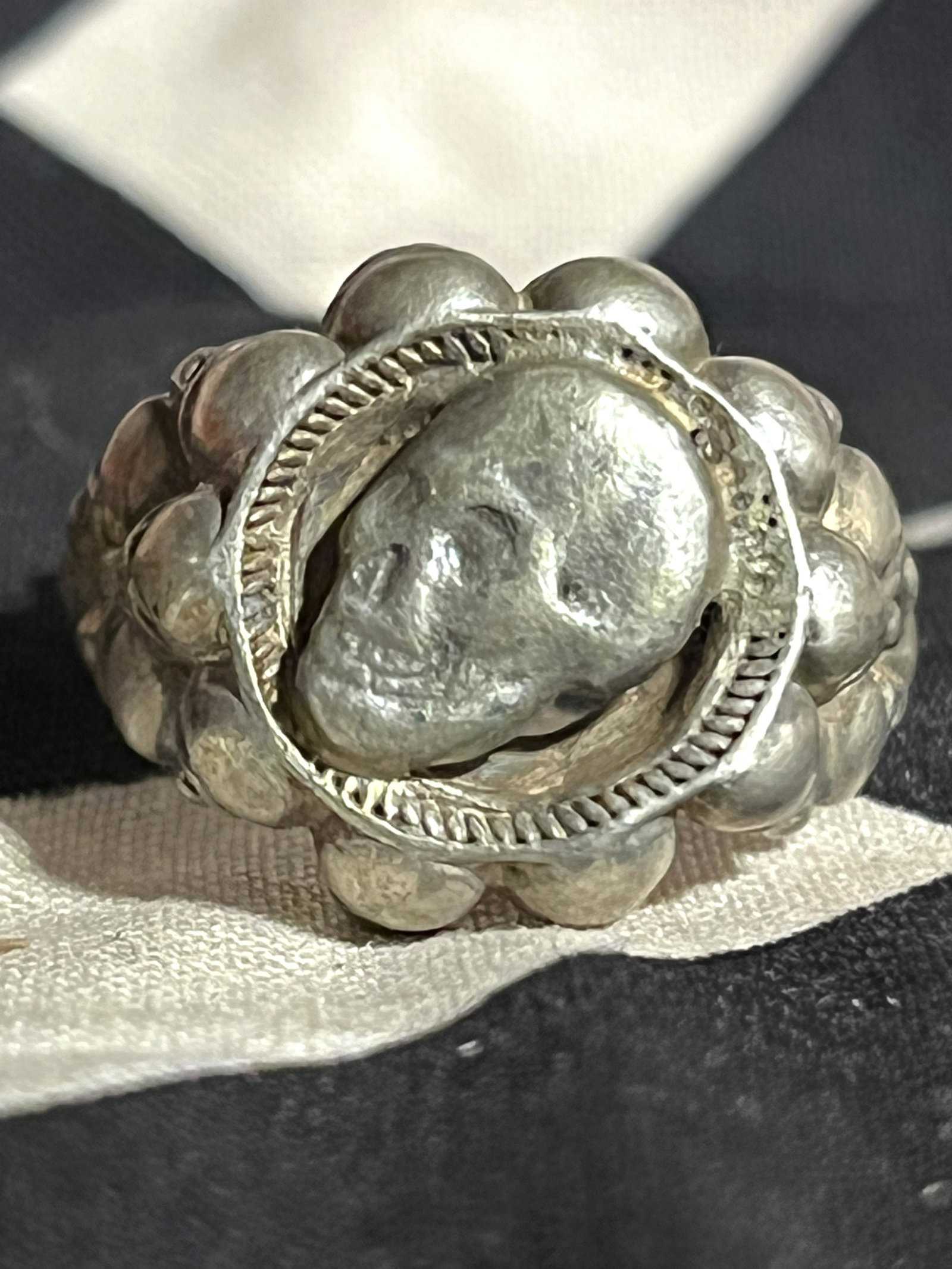 WW2 GERMAN TOTENKOPF SS SKULL SILVER 830 RING SZ 11: WW2 GERMAN TOTENKOPF SS SKULL SILVER 830 RING SZ 11. A VERY RARE FIND. WAS BROUGHT BACK HOME BY A VET. HAS A LARGER SKULL DESIGN ON THE FRONT, FOLLOWED BY MULTIPLE SKULLS ON THE SIDES. RING HAS 830 MA