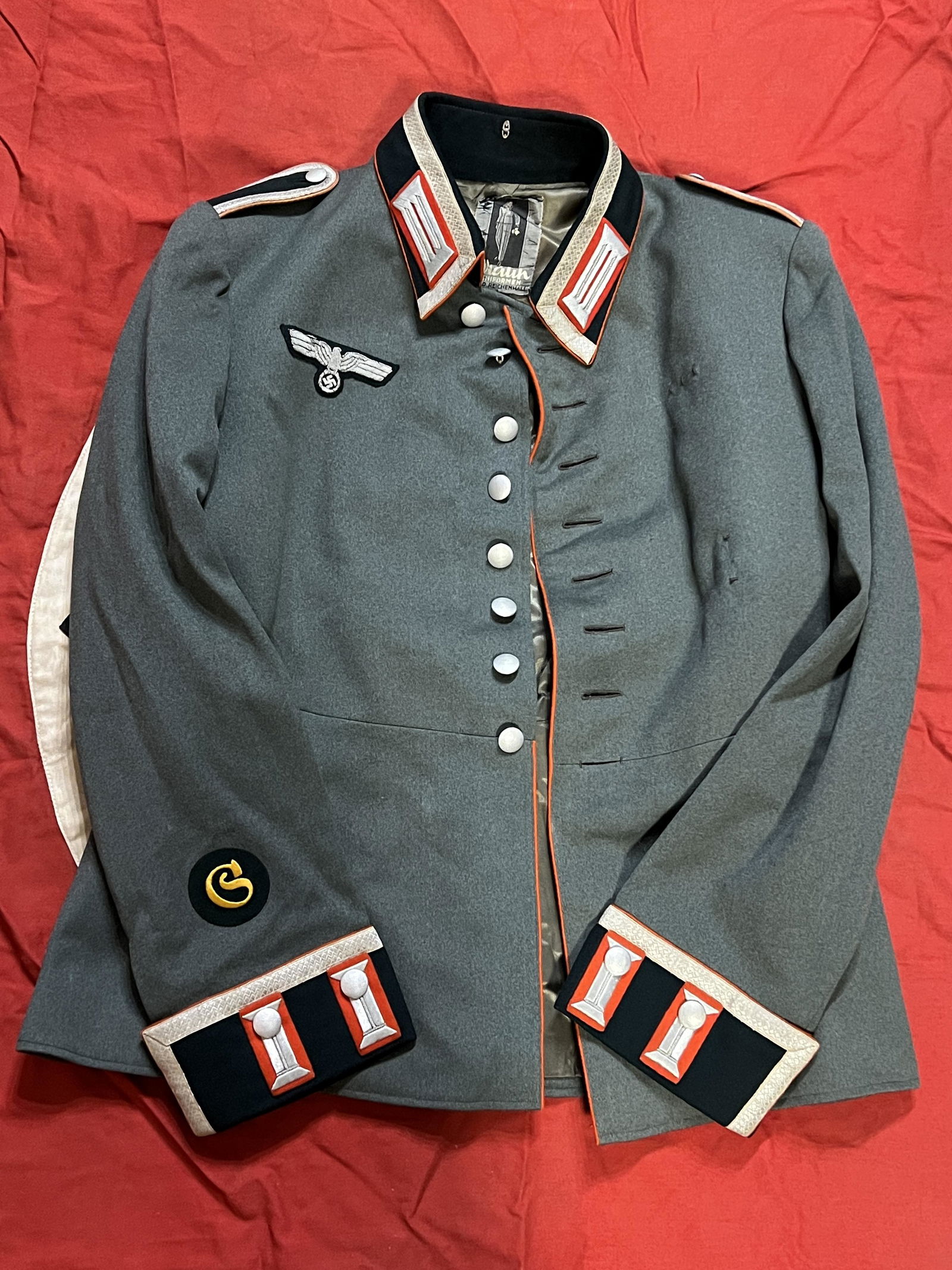 WW2 GERMAN ARMY ARTILLERY NCO WAFFENROCK UNIFORM: WW2 GERMAN ARMY ARTILLERY NCO WAFFENROCK UNIFORM. A RARE FIND. IT IS IN MINT OVERALL SHAPE AND CONDITION WITH A BEAUTIFUL OVERALL PATINA. THIS IS A NICER AND RARE EXAMPLE AS IT HAS THE TAYLOR TAG ON T
