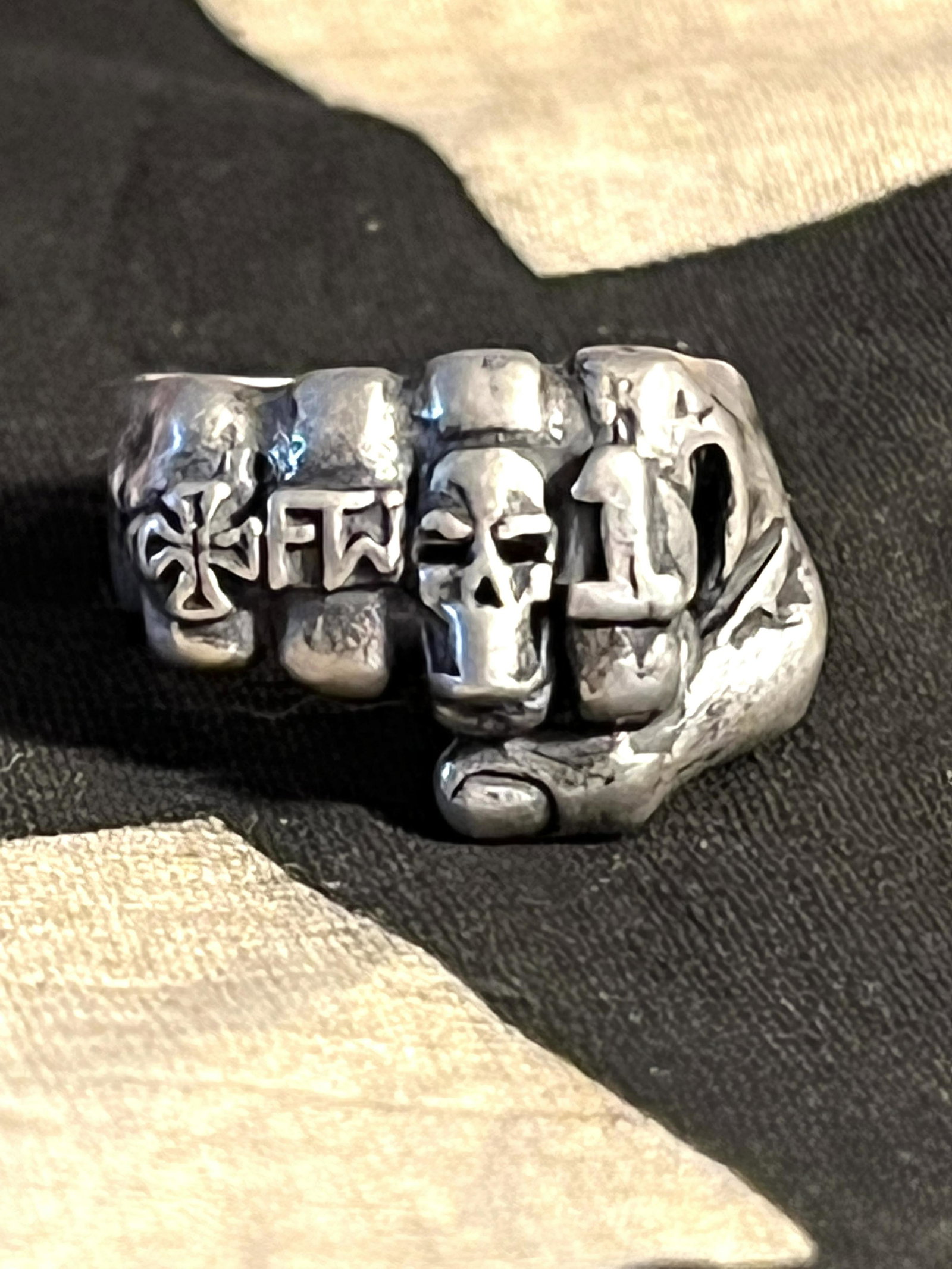 RARE WW2 GERMAN IRON FIST SS OFFICER SILVER RING - 800: RARE WW2 GERMAN IRON FIST SS OFFICER SILVER RING - 800 SILVER. RING IS A SIZE 9. A VERY RARE HARD TO FIND GERMAN SS OFFICER RING. RING DEPICTS IRON CROSS, SKULL, AND THE #1 ON THE FINGERS. A RARE GERM