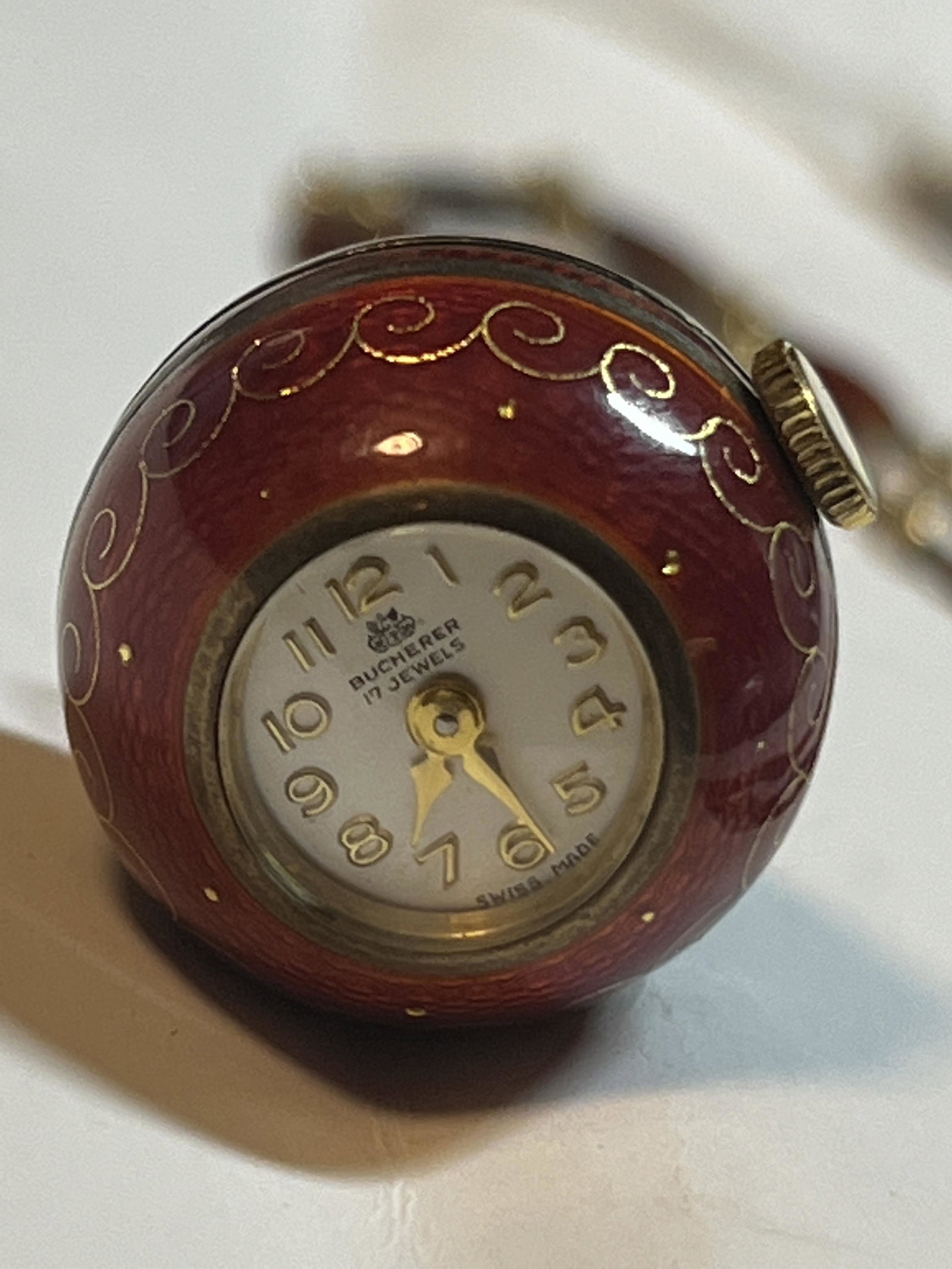 ANTIQUE SILVER ENAMEL BUCHERER WATCH W/CHAIN: ANTIQUE SILVER ENAMEL BUCHERER WATCH W/CHAIN. A RARE FIND. IN MINT OVERALL SHAPE AND CONDITION. HAS A GREAT LOOK TO IT WITH AN EXCELLENT OVERALL EYE APPEAL. COMES WITH THE ORIGINAL MATCHING WATCH CHAI