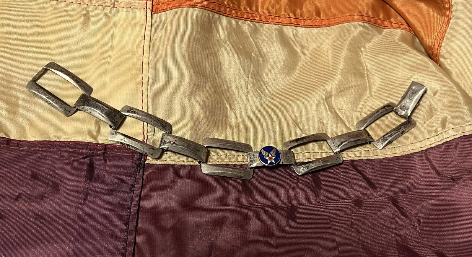 WW2 U.S. PILOTS STERLING SILVER BRACELET: WW2 U.S. PILOTS STERLING SILVER BRACELET. A RARE FIND. IT IS IN MINT OVERALL SHAPE AND CONDITION WITH A BEAUTIFUL OVERALL PATINA. A GREAT FIND AND AN EXCELLENT ADDITION TO YOUR COLLECTION.