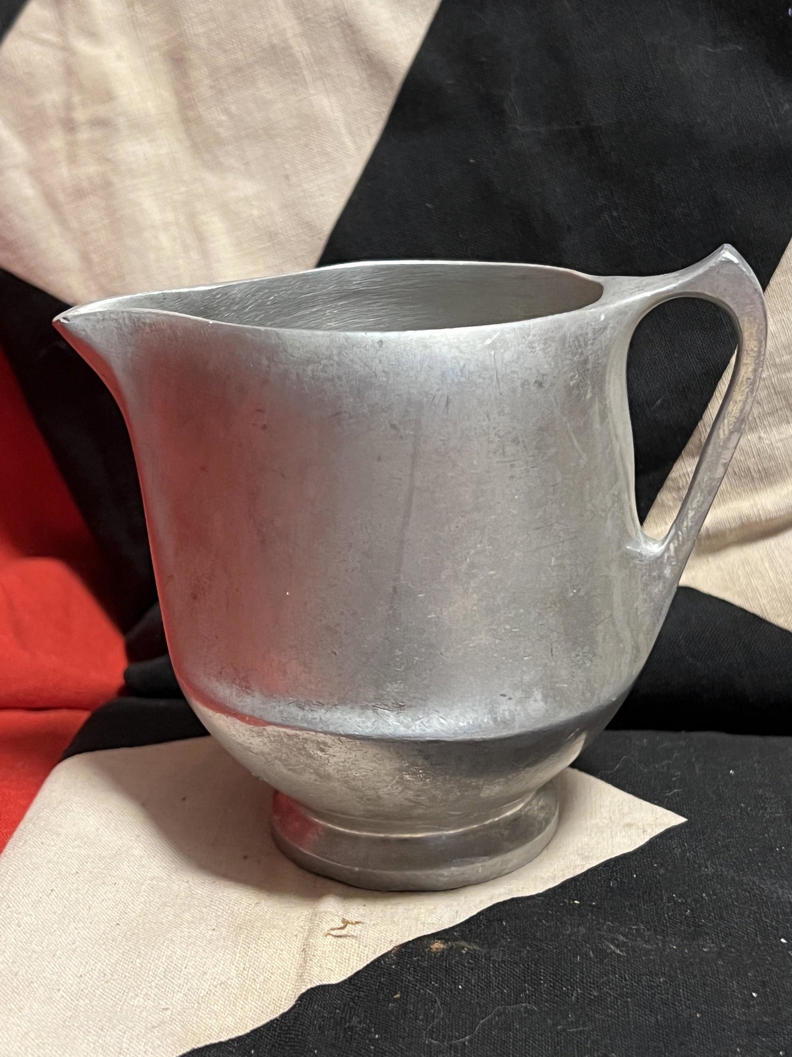 MARKED WAFFEN SS WW2 GERMAN CREAMER CUP: MARKED WAFFEN SS WW2 GERMAN CREAMER CUP. A RARE FIND. IT IS IN MINT OVERALL SHAPE AND CONDITION WITH A BEAUTIFUL OVERALL PATINA. WAS BROUGHT BACK HOME BY A VET. A GREAT FIND AND AN EXCELLENT ADDITION 