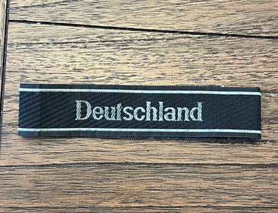 WW2 GERMAN OFFICER DEUTSCHALND CUFF TITLE: WW2 GERMAN OFFICER DEUTSCHALND CUFF TITLE. WAS BROUGHT BACK HOME BY A VET. IT IS IN MINT OVERALL SHAPE AND CONDITION WITH A BEAUTIFUL OVERALL BATTLE USED PATINA. A GREAT FIND AND AN EXCELLENT